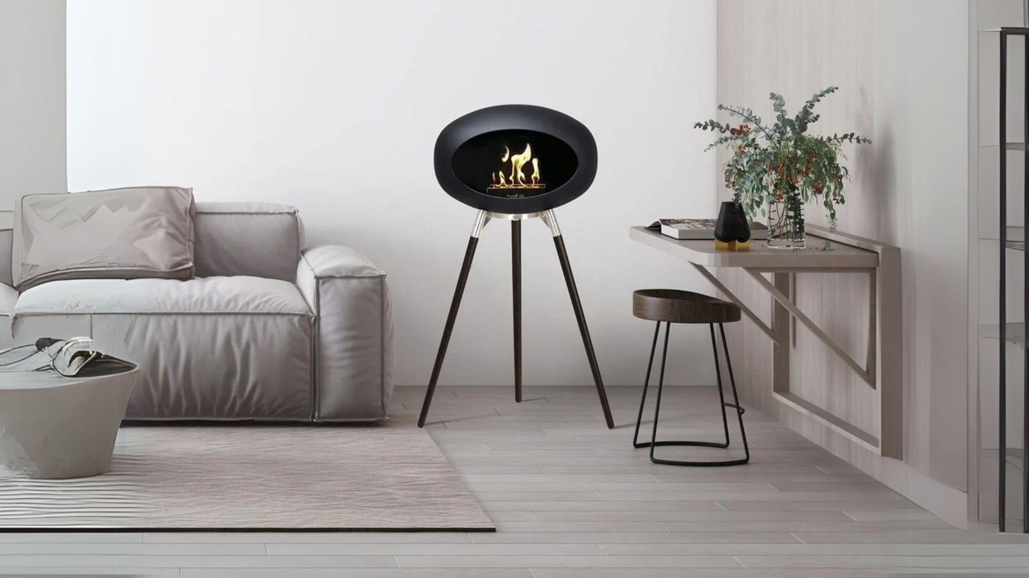 Tripod Indoor Outdoor Ethanol Fireplace with wooden tripod legs and metal dome, perfect for cozy indoor or outdoor ambiance.