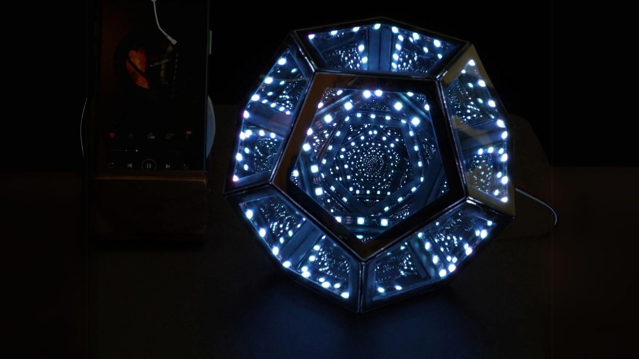 Geometric Infinity Lamp (RGB) glowing bright with infinite light tunnel effect, perfect for mood lighting and game room decor.