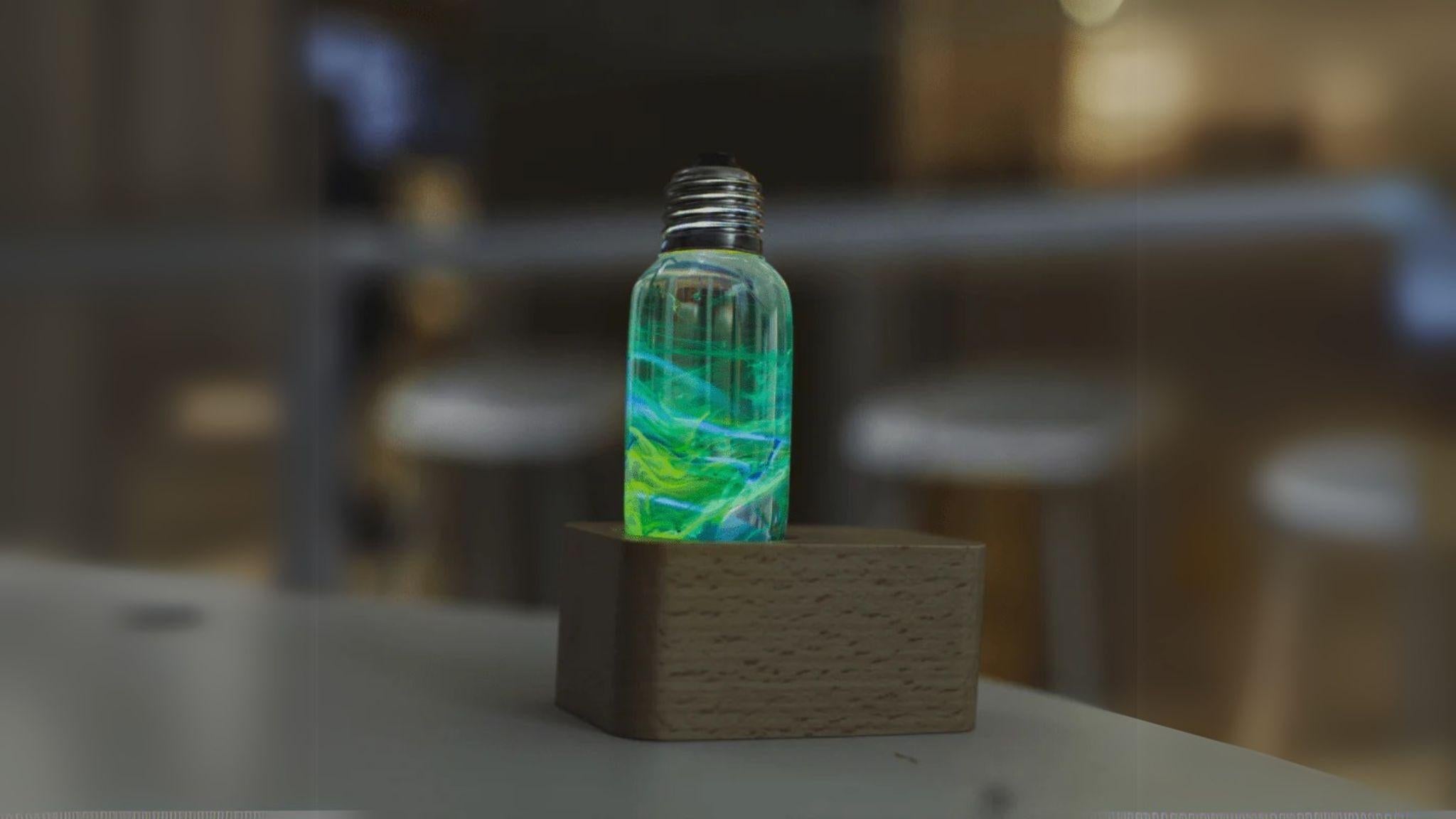 EP Light - Prairie bulb with unique glowing resin design on wooden base, energy-saving and handcrafted for radiant ambiance.