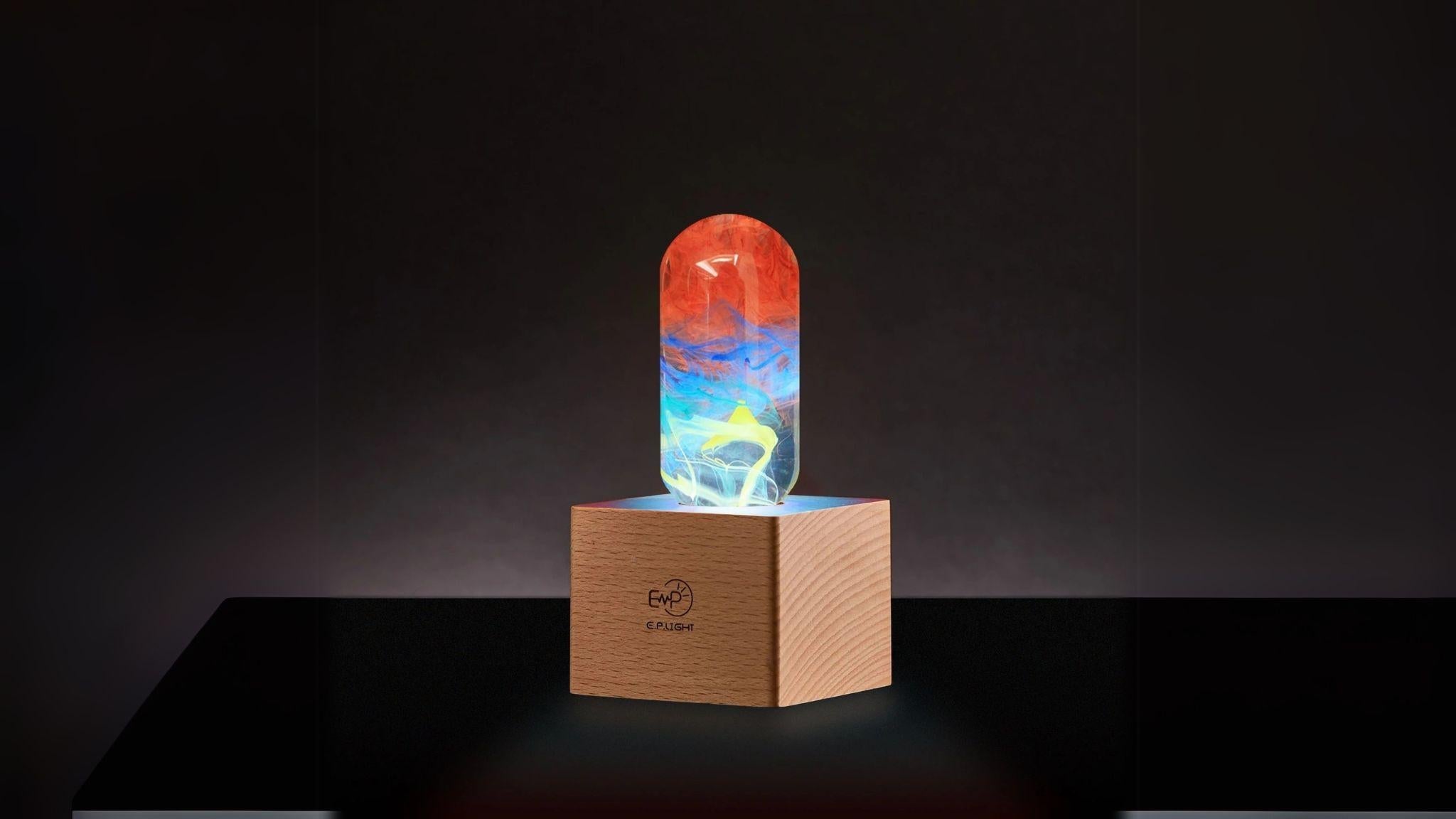 EP Light - Youth LED tubular bulb with unique eco-friendly resin design on wooden base, fits standard E26/E27 sockets.