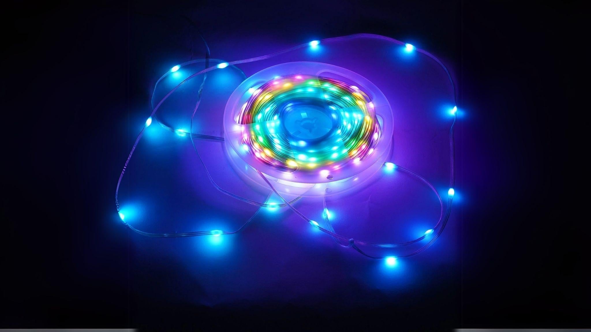 65 ft. Waterproof RGB Smart LED Strip Lights glowing with vibrant blue and multicolor effects for indoor and outdoor ambiance.