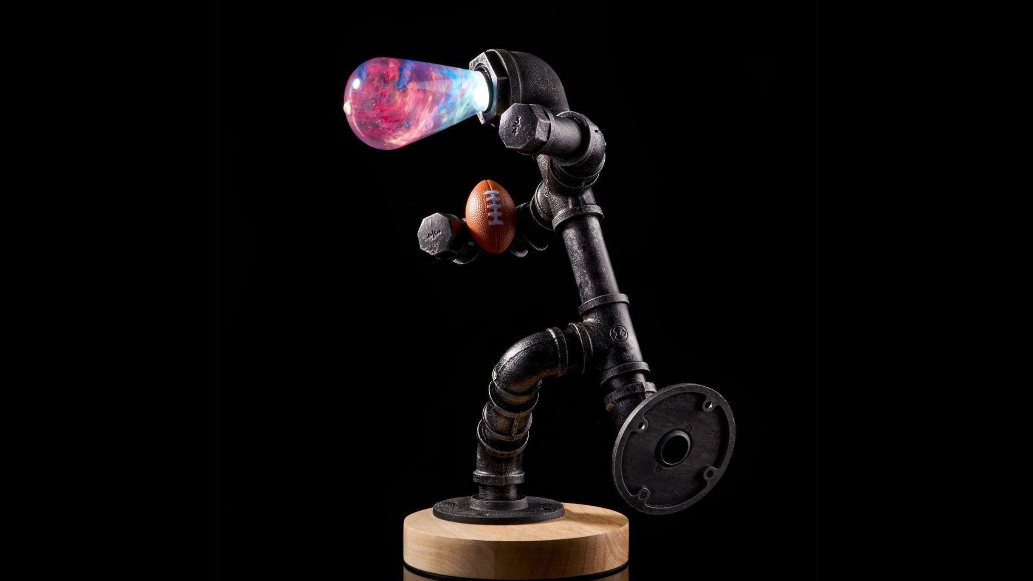 EP Light - Elsa bulb with unique frosty glow and handcrafted eco-resin design on industrial pipe base.