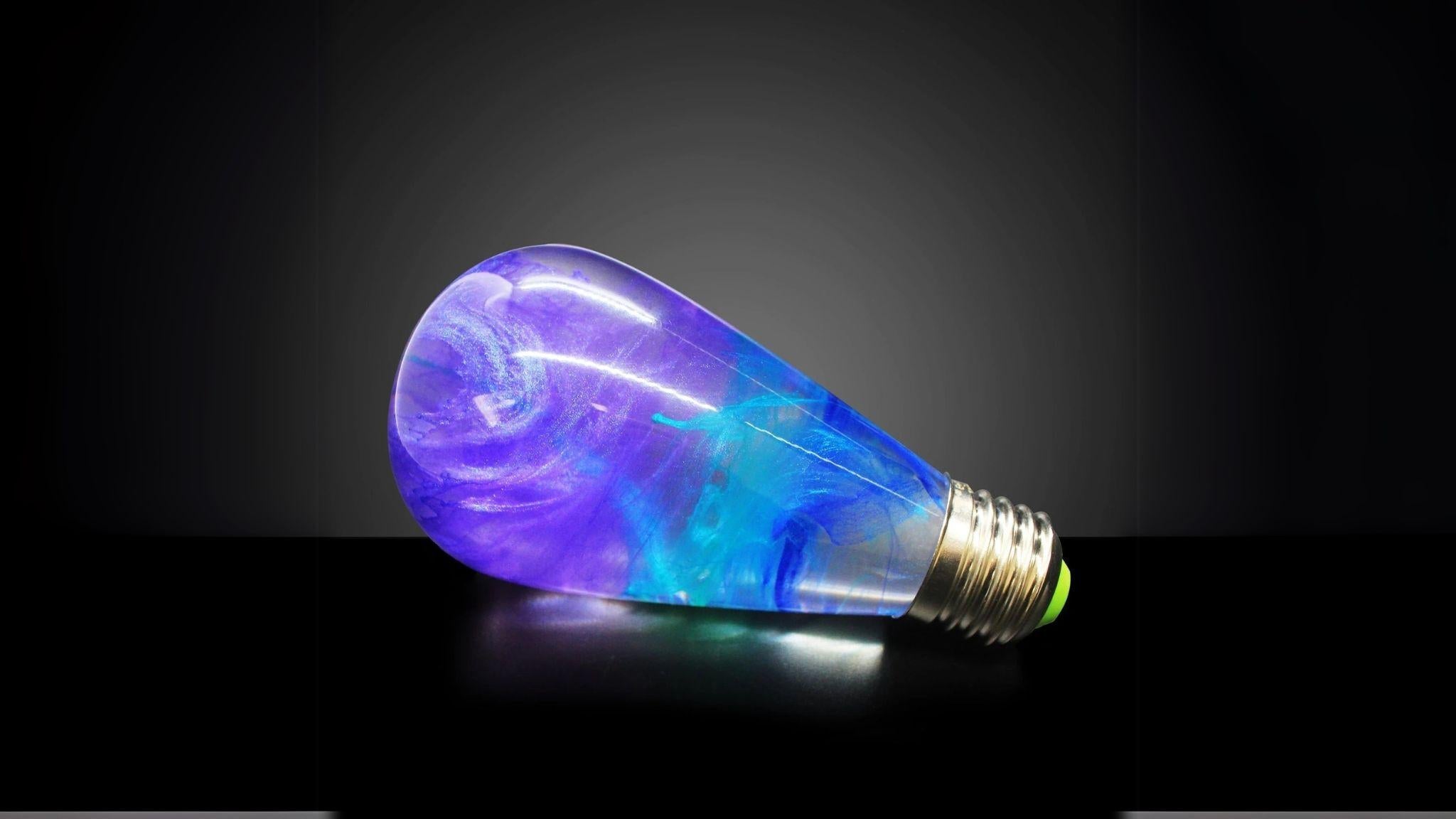 EP Light - Faith artistic LED bulb with vivid resin swirls, energy-efficient, fits E26/E27 sockets, unique handcrafted design.