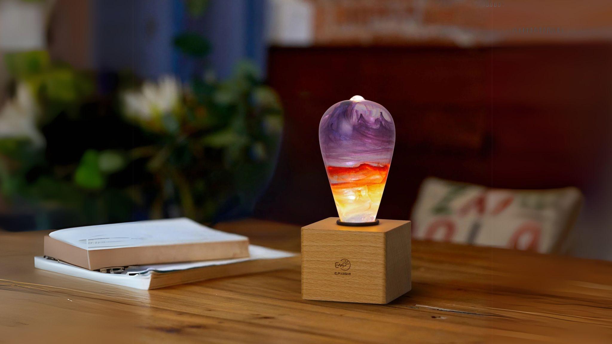 EP Light - Passion handcrafted eco-resin bulb with vibrant colors on wooden base, radiating creative, energy-efficient light.