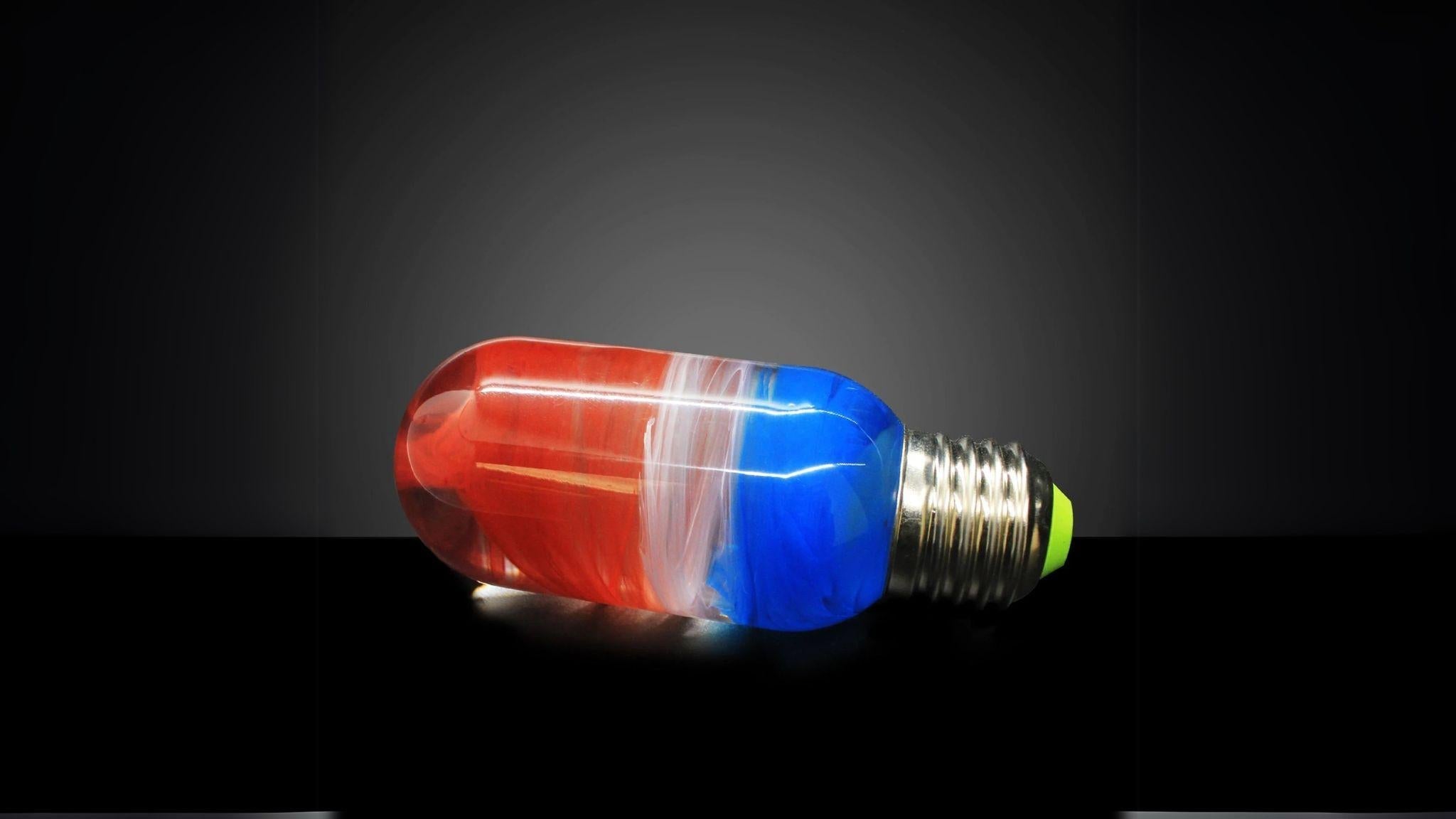 EP Light - Sunrise bulb featuring vibrant handcrafted red, white, and blue resin in an E26/E27 LED light.