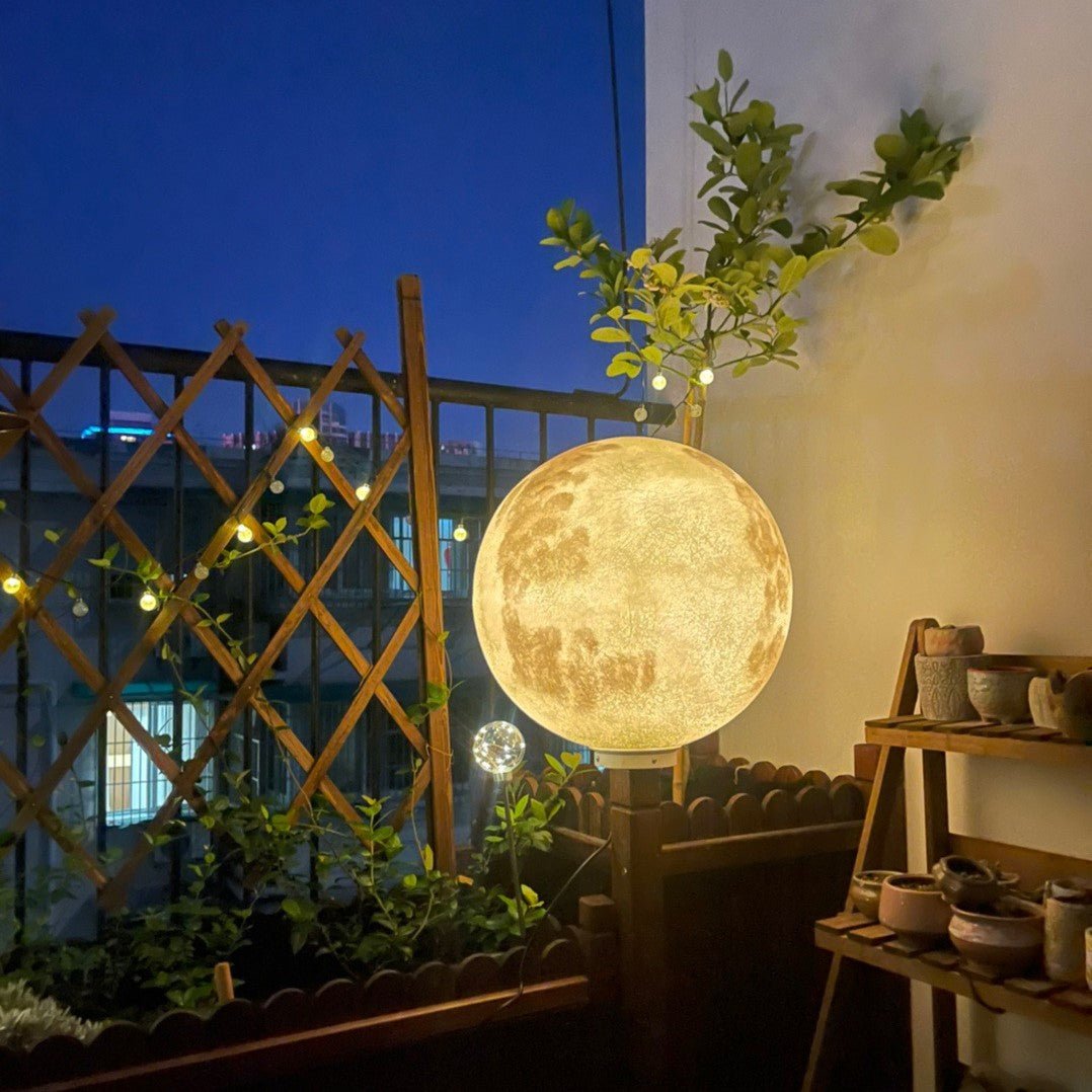 3D Moon Indoor & Outdoor Floor Lamp glowing warmly on a balcony, perfect for ambient indoor and outdoor lighting.