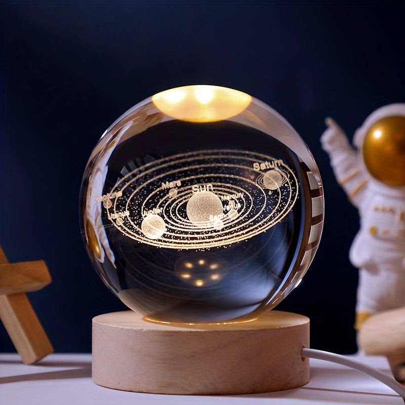 3D Solar System Crystal Ball Light with laser-etched planets illuminated on a wooden base, perfect unique space decor.