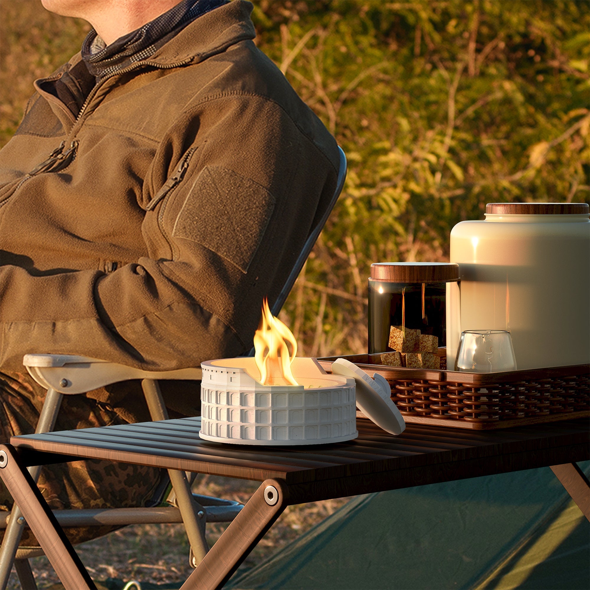 Colosseum Tabletop Fire Pit burning clean alcohol flame on a portable table outdoors for cozy warmth.