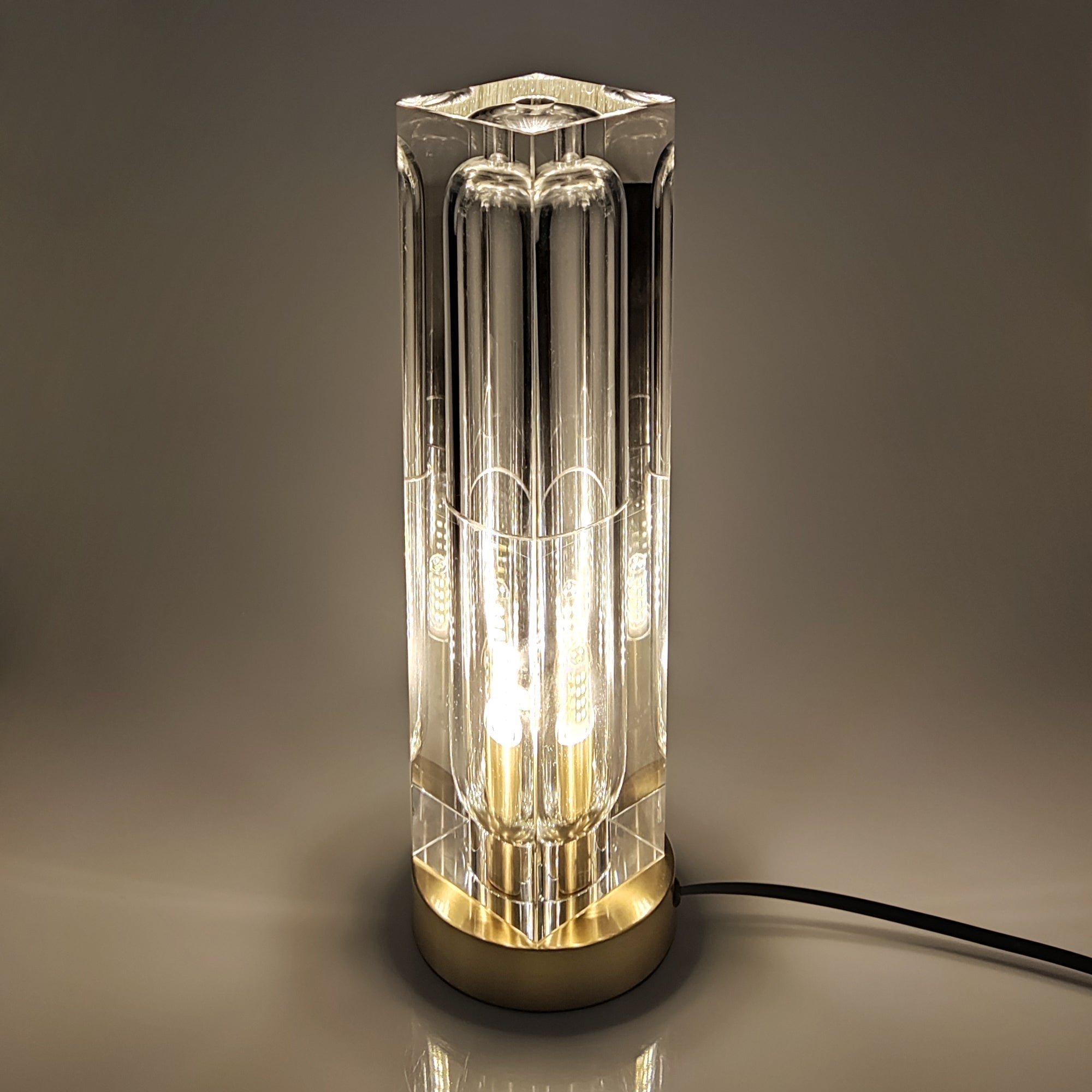 Crystal Bedside Table Lamp with modern crystal shade and brass base, offering elegant, adjustable LED lighting.
