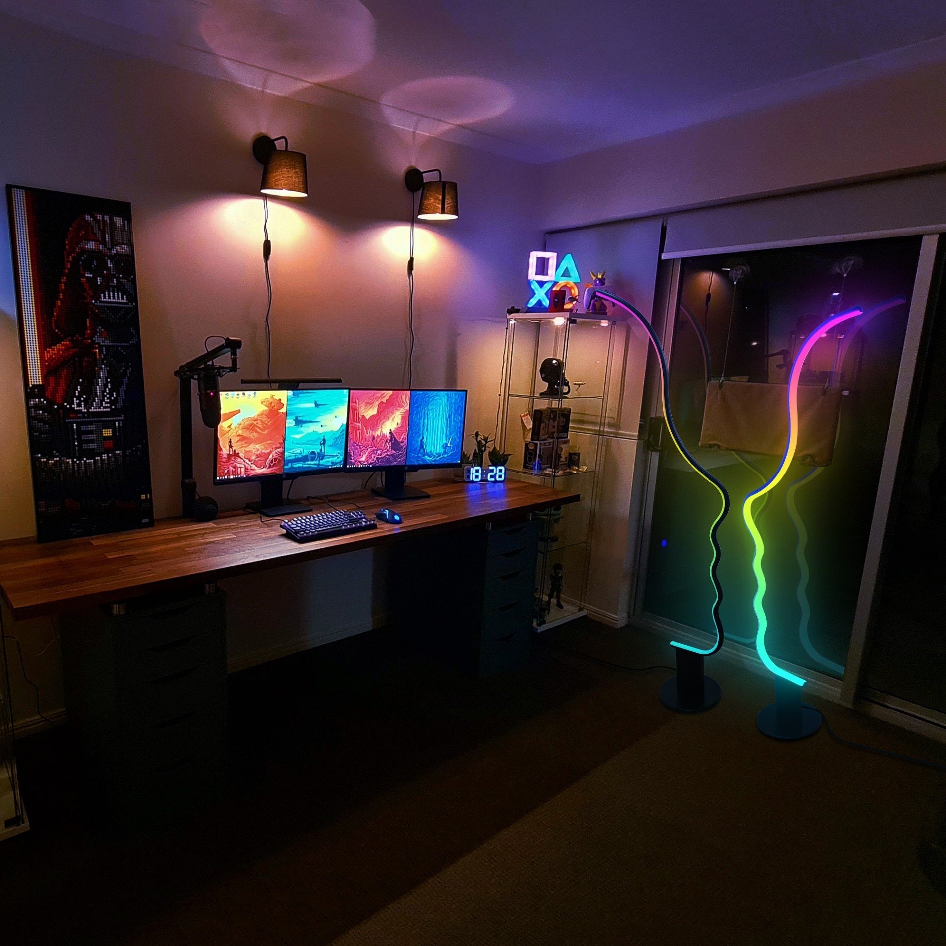 Edward Visage RGB Lamp illuminating a modern gaming setup with vibrant customizable LED lighting effects.
