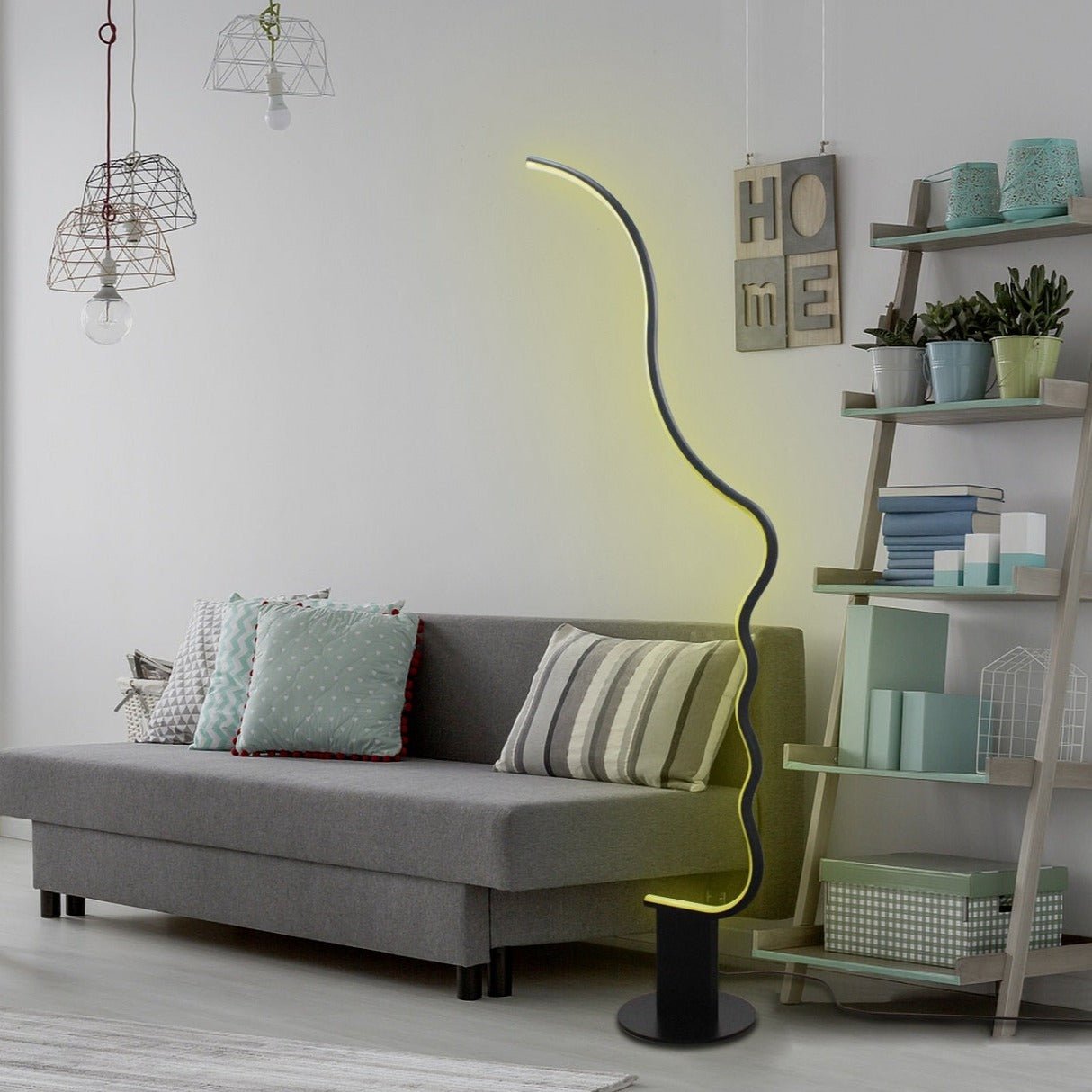 Edward Visage RGB Lamp with stylized human face silhouette lighting a modern living room space.