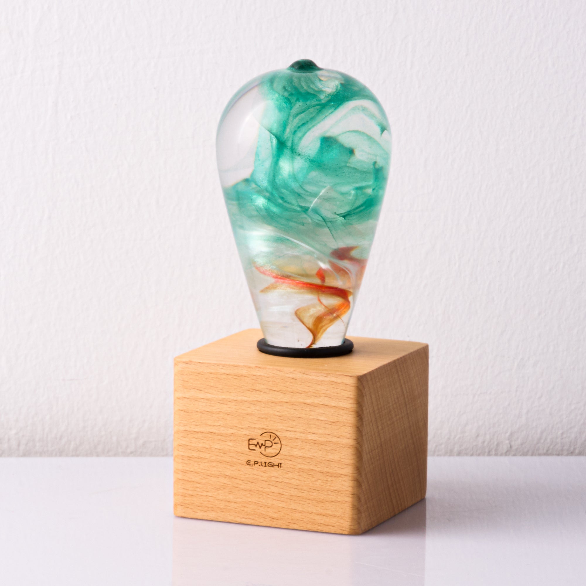 EP Light - Aquaria lamp with unique eco-resin design on wooden base, offering vibrant ocean-inspired lighting.