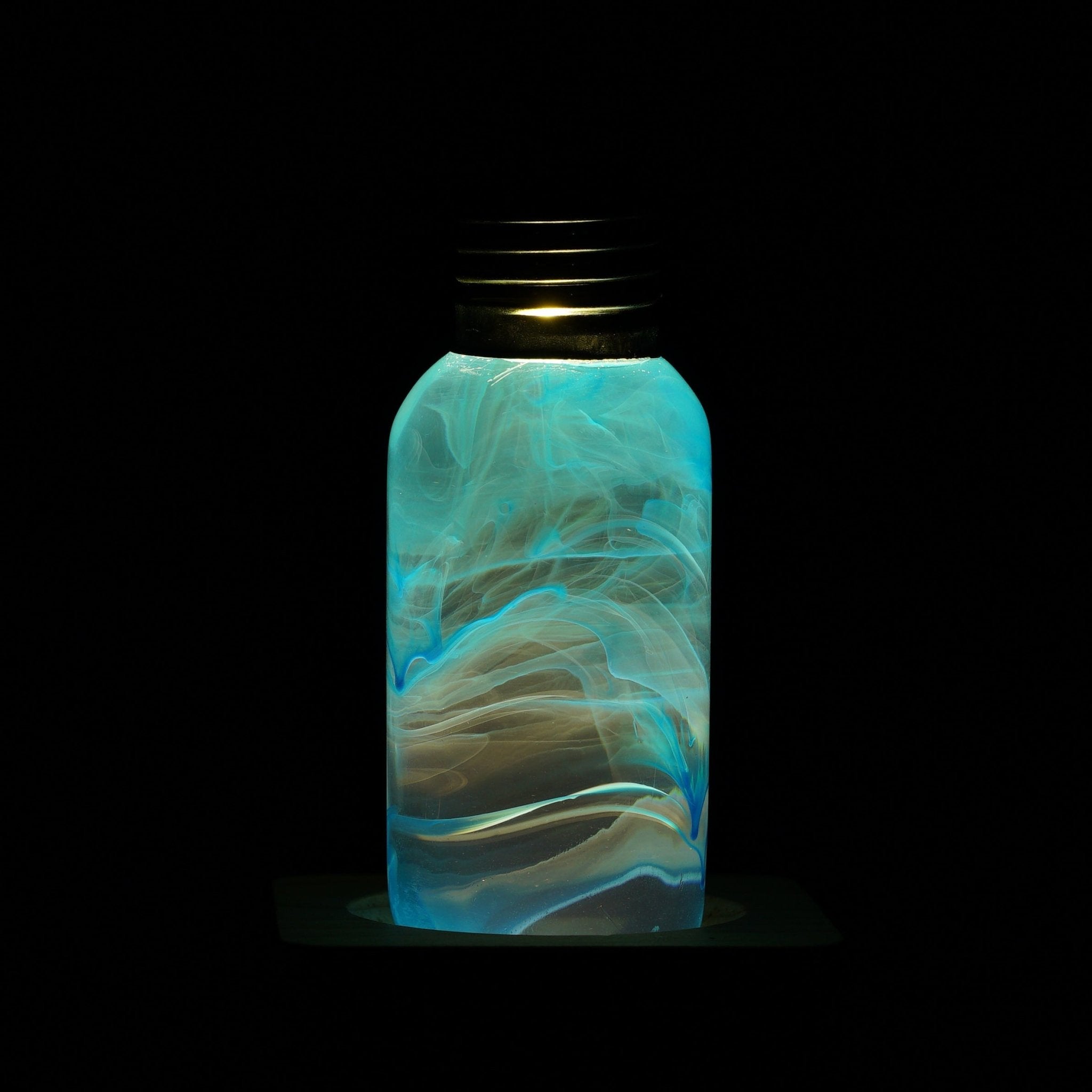 EP Light - Blue bulb glowing with unique handcrafted blue resin design, eco-friendly and drop-resistant lighting solution.