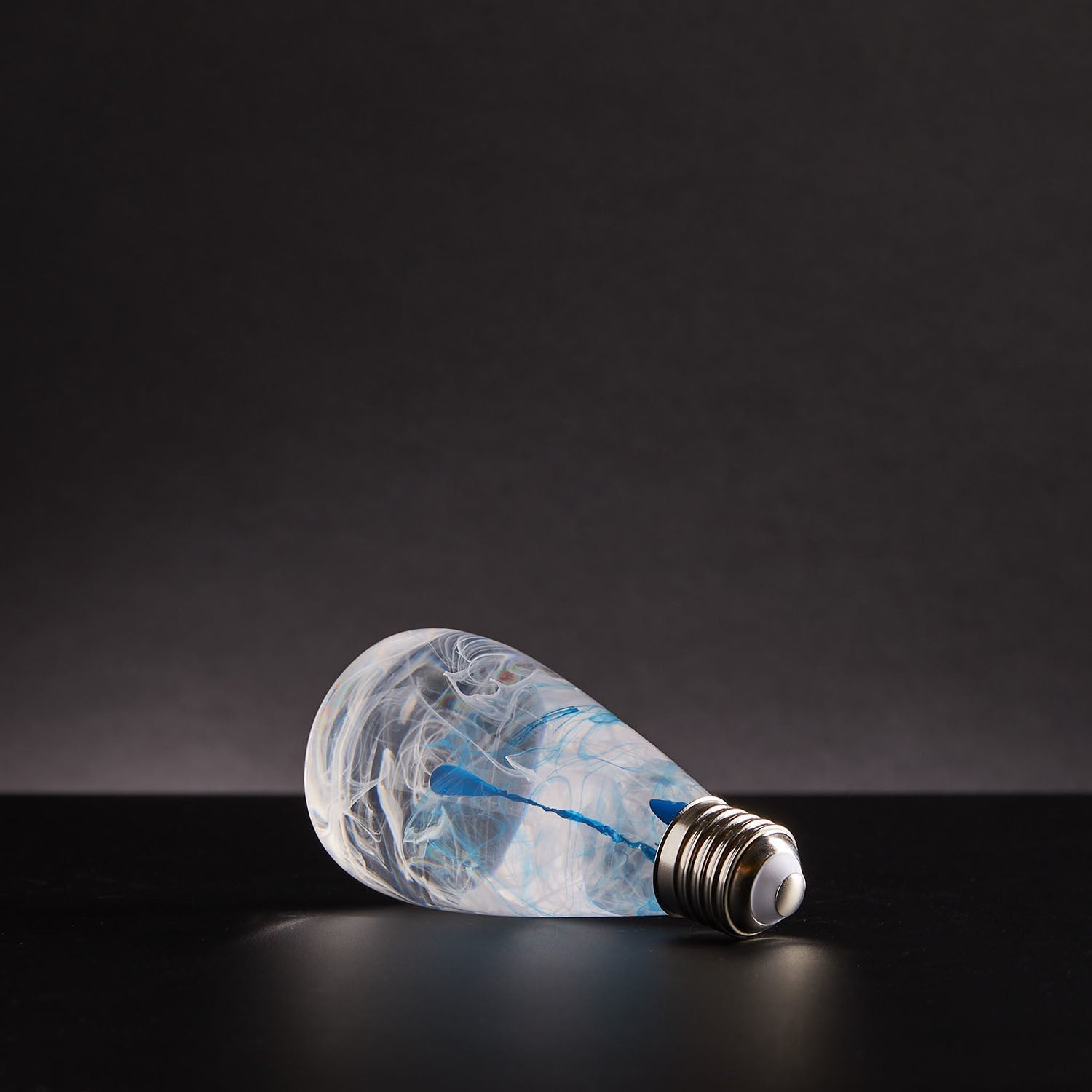 EP Light - Blue Drop handcrafted LED lightbulb with unique blue resin design, blending art and energy-saving technology.