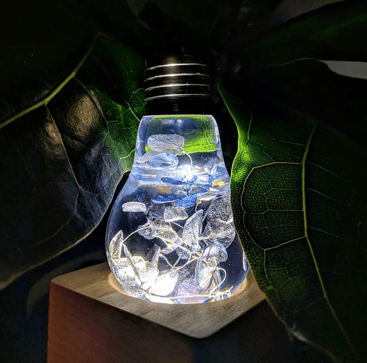 EP Light- Blue Hydrangea bulb with handcrafted blue floral resin design glowing softly in ambient light.