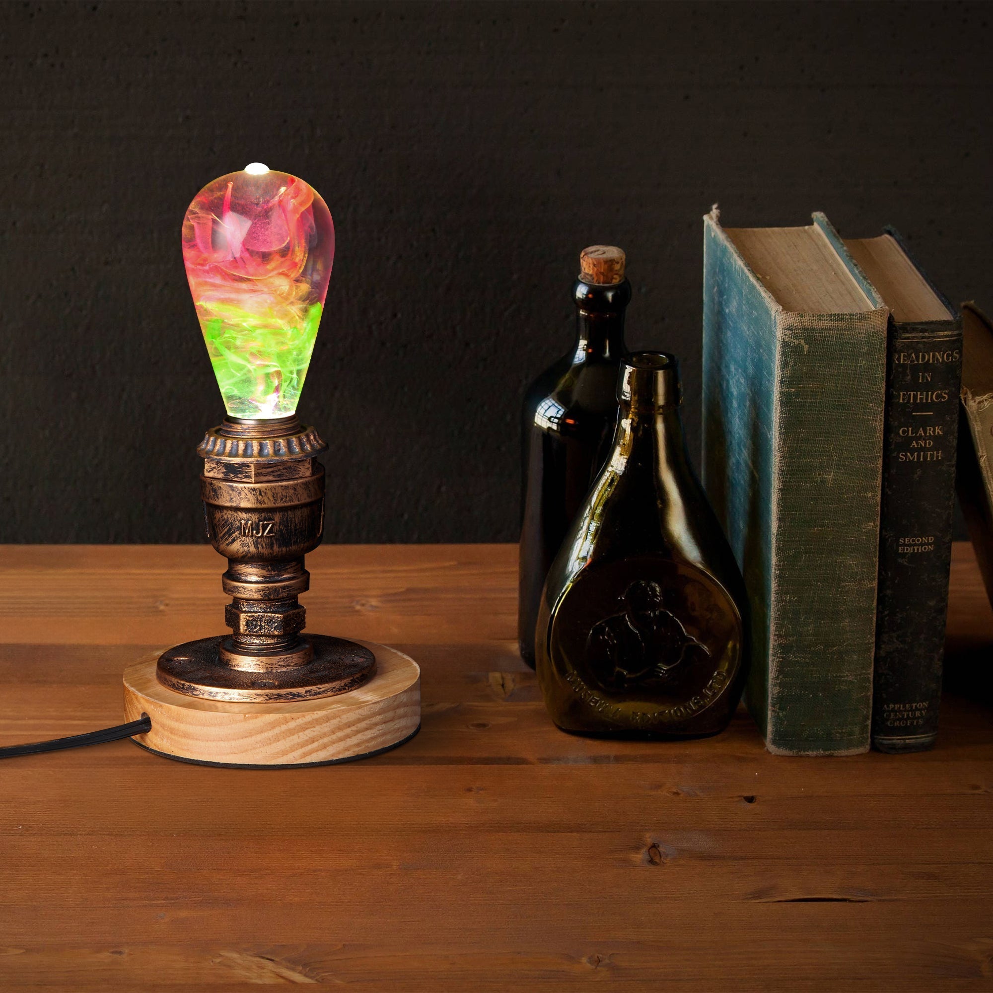 EP Light - Coral handcrafted eco-resin bulb glowing vibrant coral hues with energy-saving LED on vintage wooden stand.