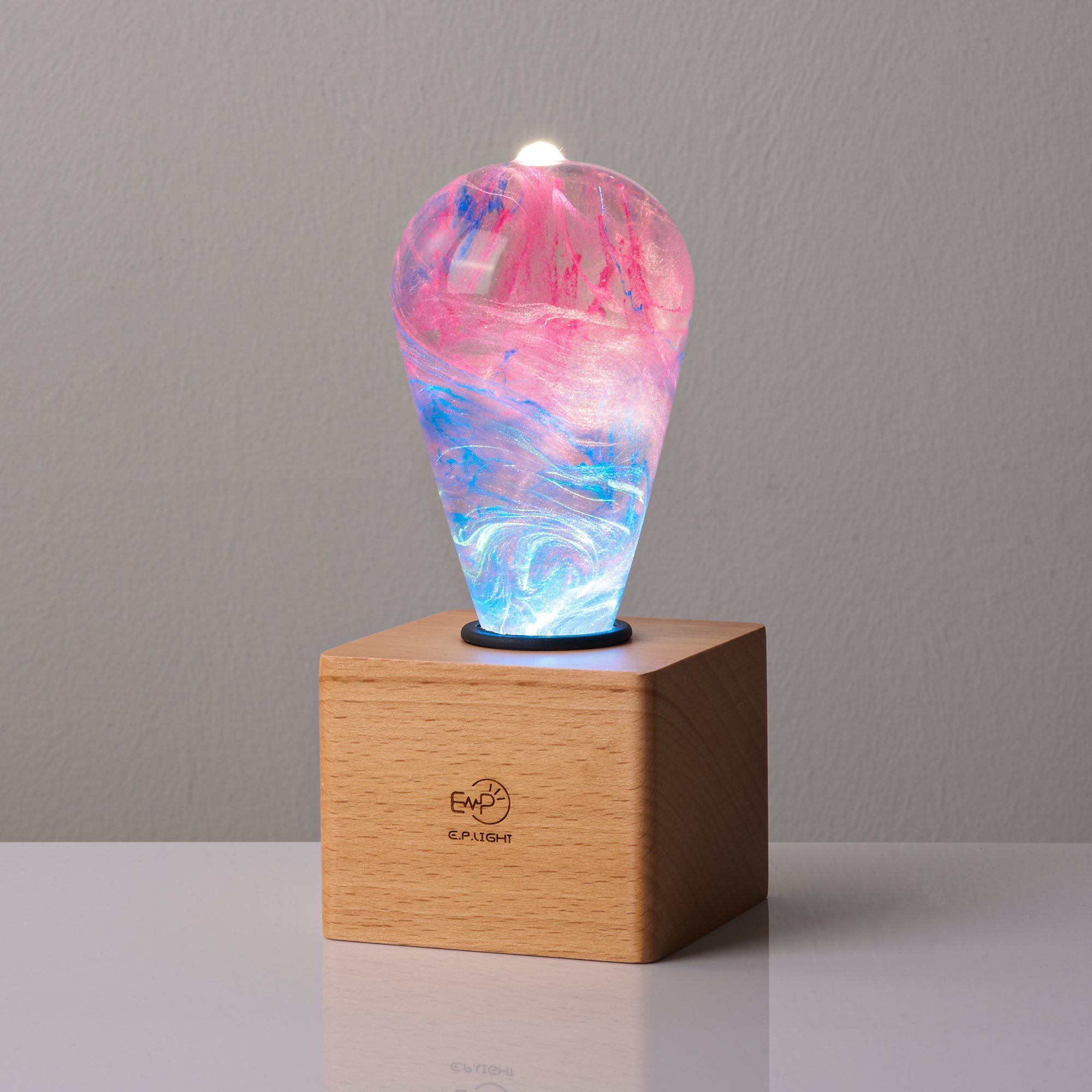 EP Light - Elsa bulb emits a unique frosty glow with handcrafted eco-resin design on a wooden base.