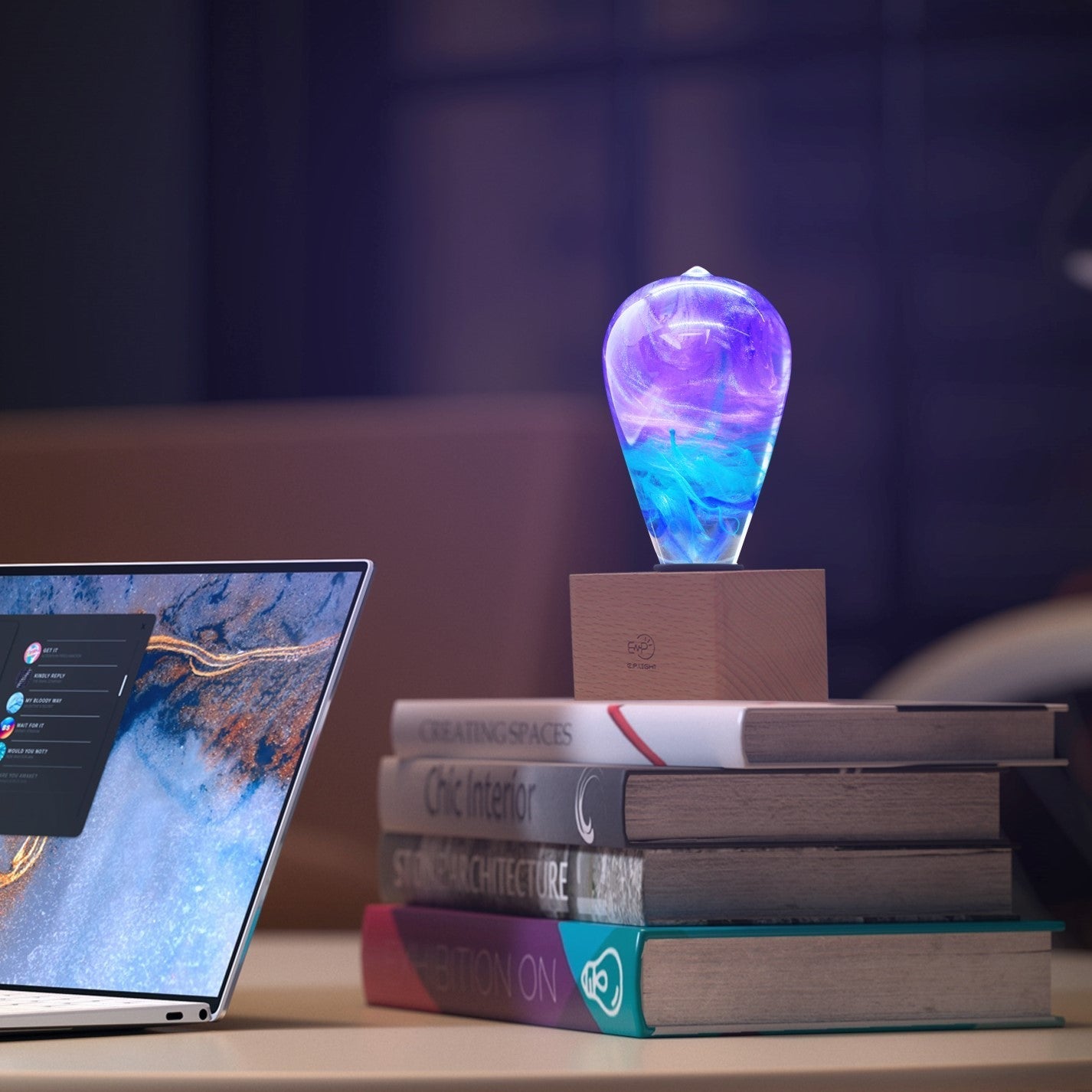 EP Light - Faith handcrafted LED bulb glowing with vivid resin colors on books in a cozy workspace setting