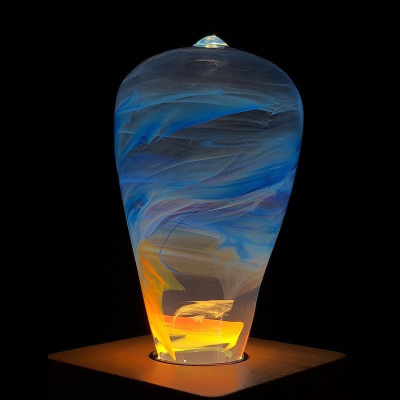 EP Light - Fire handcrafted LED bulb with swirling blue and amber flame effect for unique, cozy lighting accents.