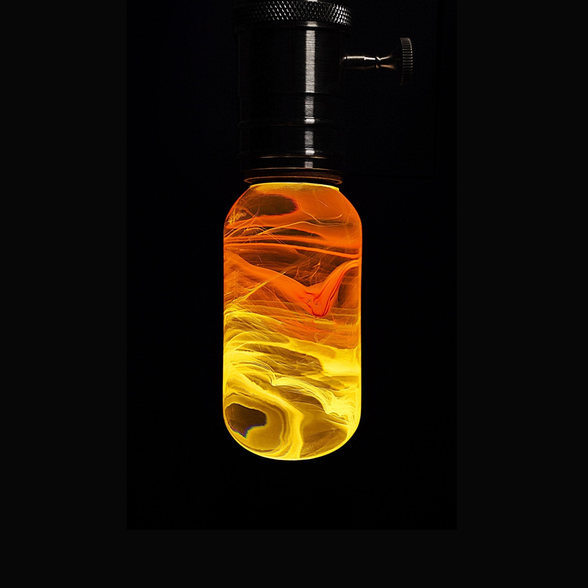 EP Light - Flame bulb glowing with unique handcrafted ember patterns, safe LED mood lighting for décor and ambiance.
