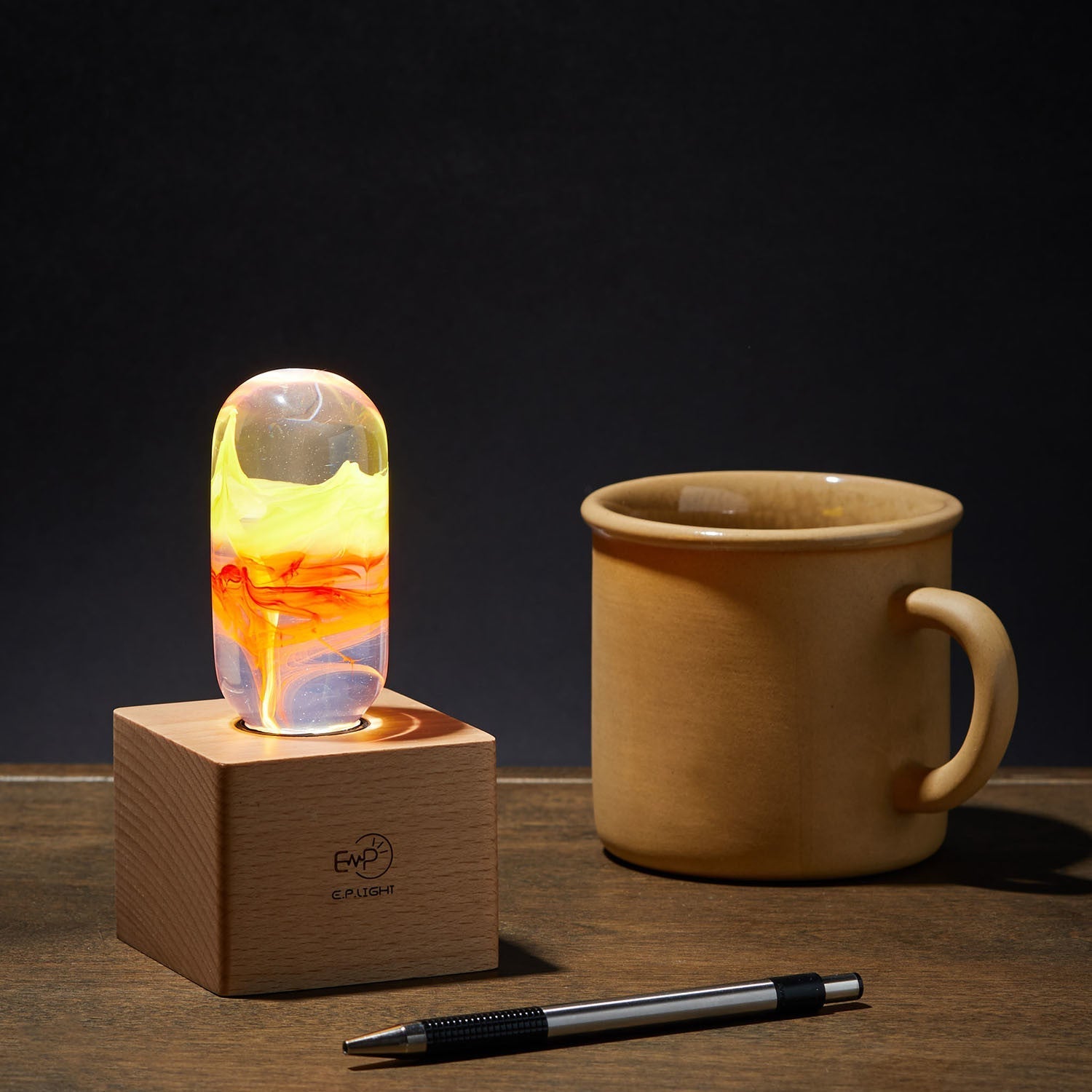 EP Light - Flame bulb on wood base glowing with fiery ember hues, perfect for mood lighting and décor.