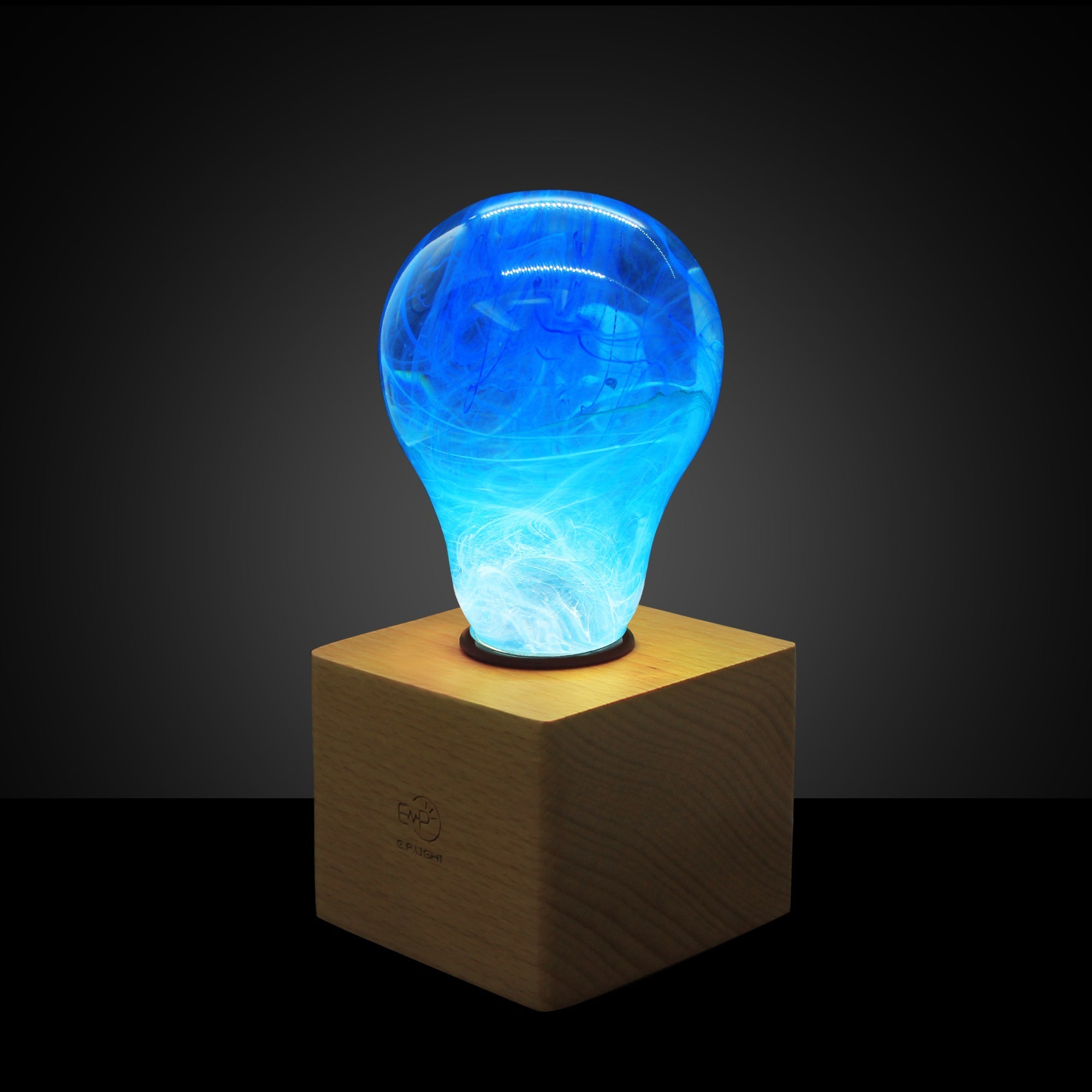 EP Light - Memory bulb with unique blue swirl design on vintage wooden base, energy-saving and handcrafted eco-resin light.
