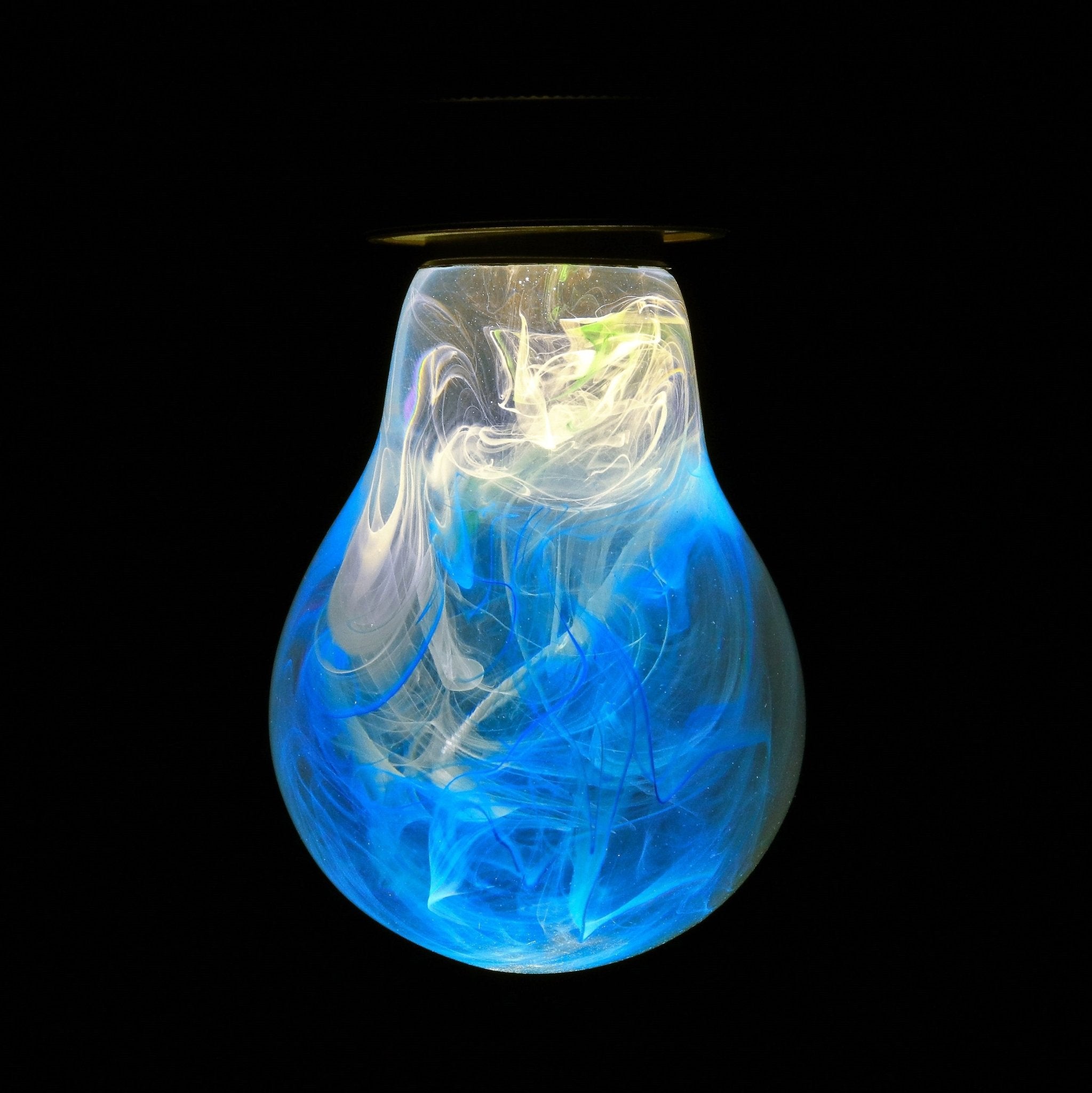 EP Light - Memory bulb with unique blue and white swirls, handcrafted eco-resin design glowing softly on a vintage base.
