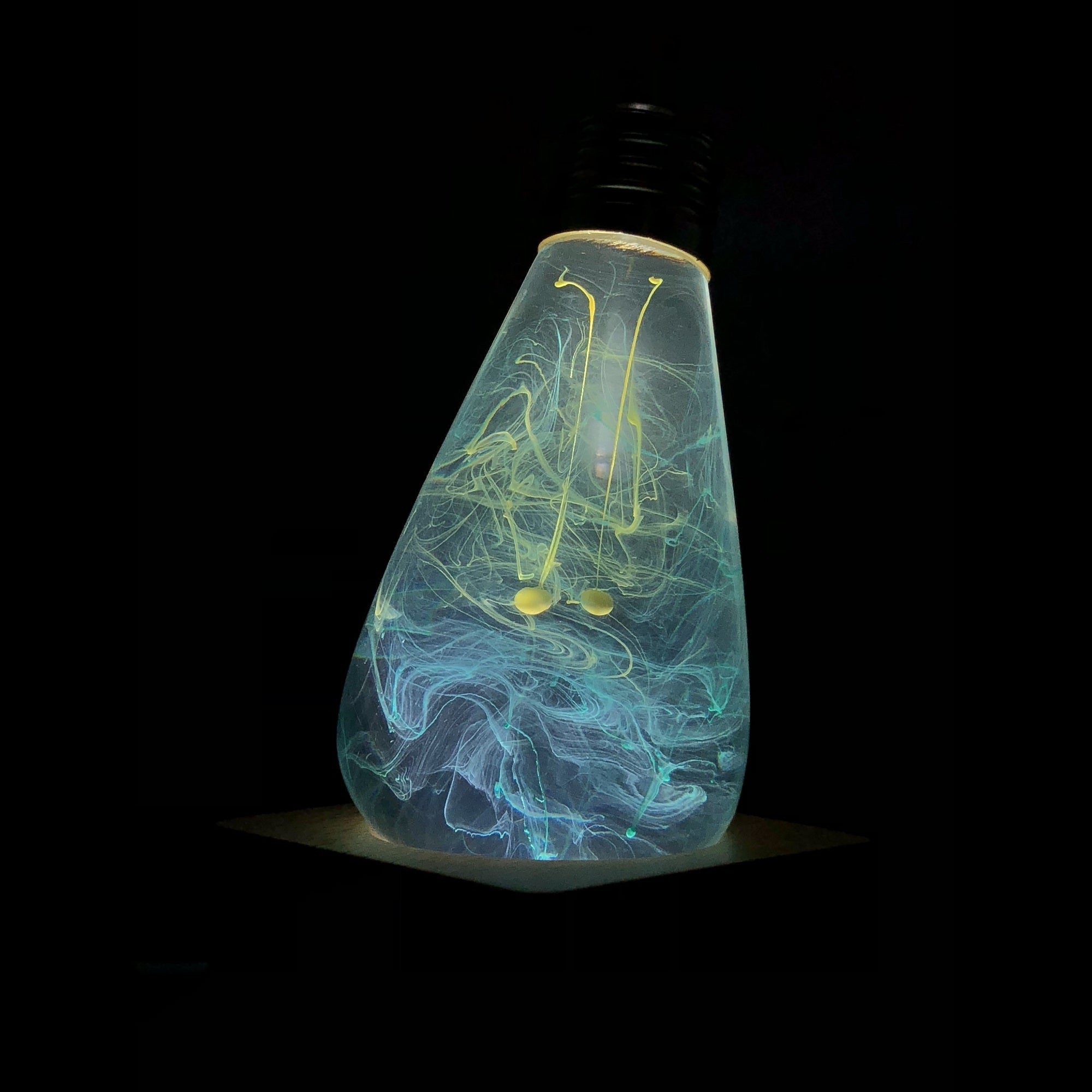 EP Light - Mind lamp glowing with unique swirling patterns, handcrafted eco-resin design inspiring calm and creativity.