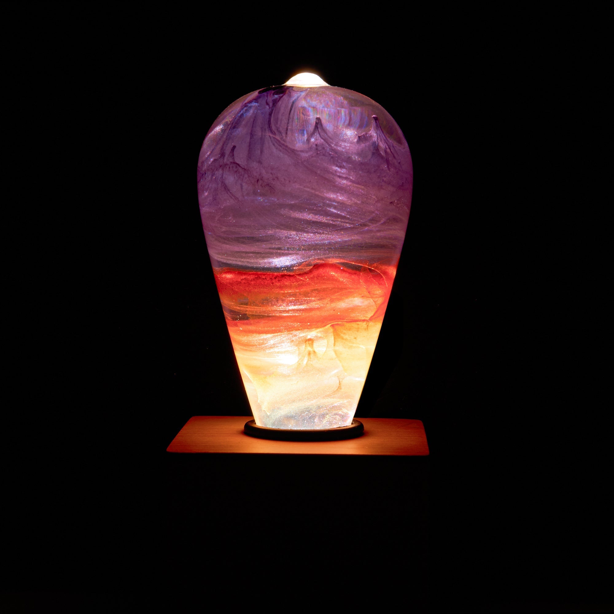 EP Light - Passion eco-resin bulb glowing with unique vibrant purple, red, and white handcrafted colors, energy-efficient design.