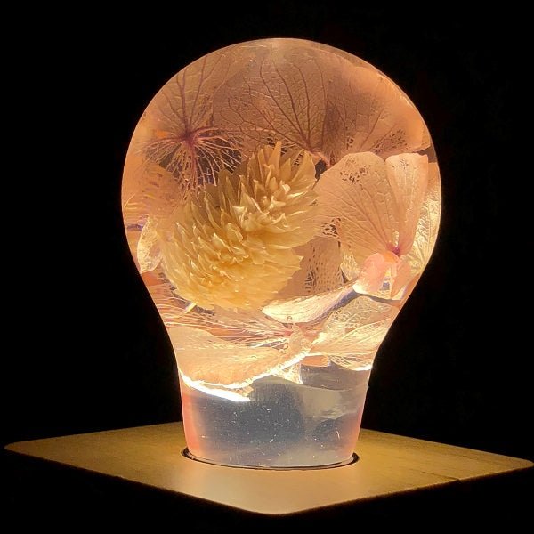 EP Light - Pink Hydrangea handcrafted eco-resin bulb glowing warmly with delicate floral interior design.