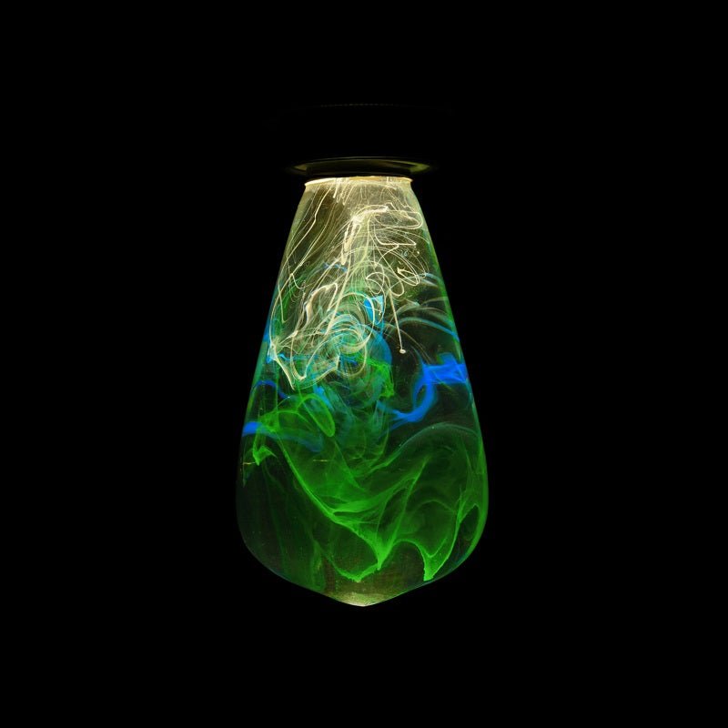 EP Light - Spring handcrafted eco-resin bulb glowing with vibrant green and blue patterns for energy-saving illumination.