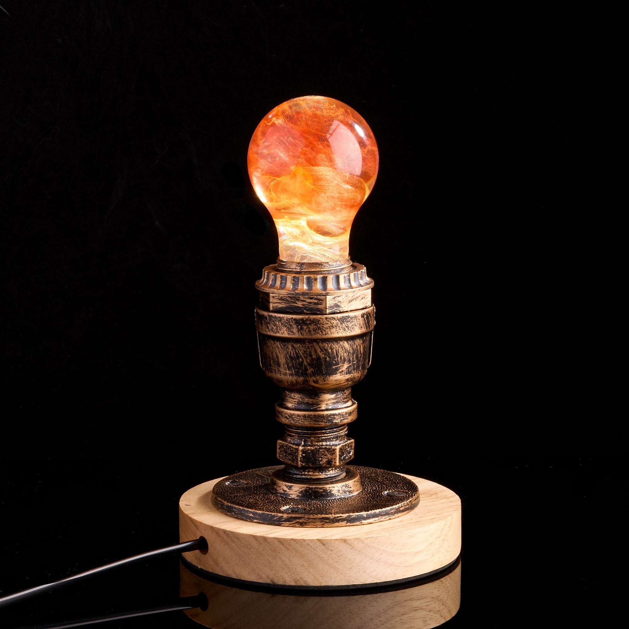 EP Light - Sunflower handcrafted eco-resin bulb glowing warmly on vintage socket with wooden base, brightening any room.