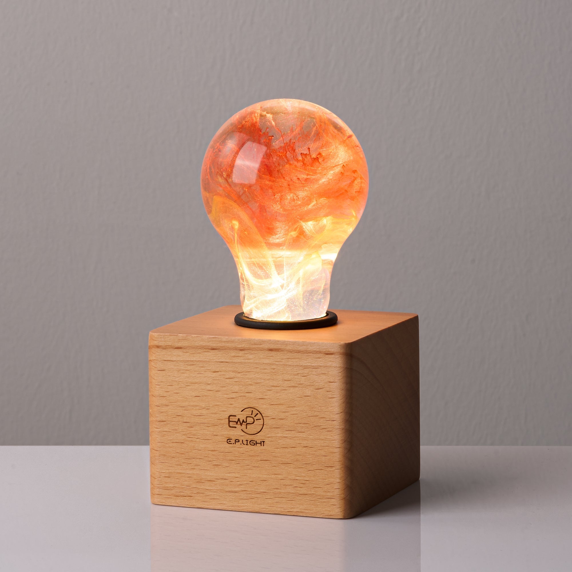 EP Light - Sunflower handcrafted eco-resin bulb with radiant sunflower design on wooden base, cool and energy-saving lighting.