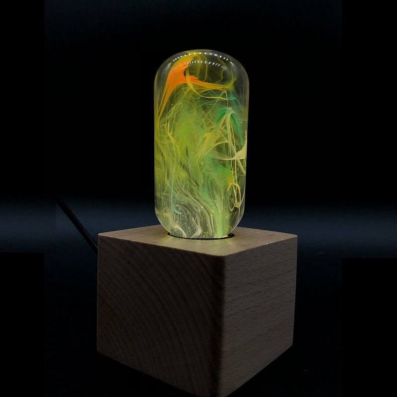 EP Light - Time handcrafted eco-resin bulb with unique artistic patterns illuminating a wooden base.