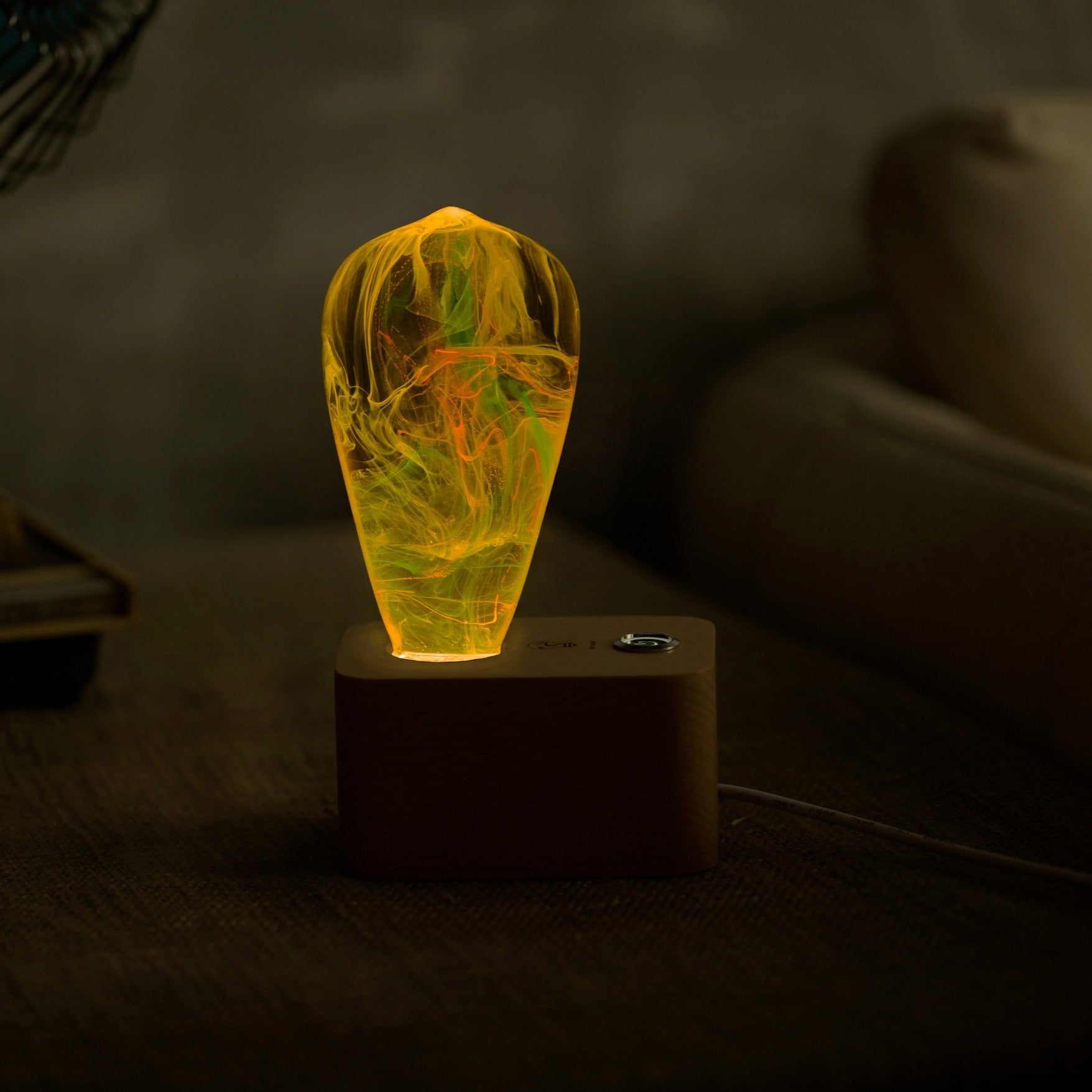 EP Light - Twilight lamp glowing with unique handcrafted eco-resin design, creating a calming sunset ambiance in a cozy room.