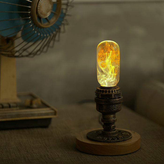 EP Light - Youth tubular LED bulb glowing with vibrant yellow and white resin patterns in a vintage-style lamp base.