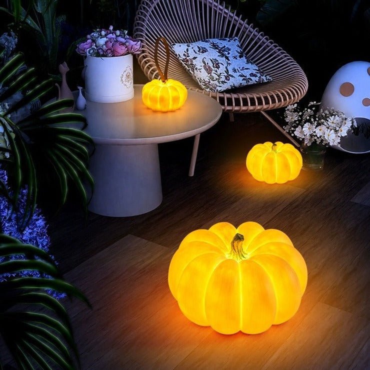 Indoor & Outdoor Pumpkin Lantern glowing warmly on porch and table, adding festive light to autumn decor.