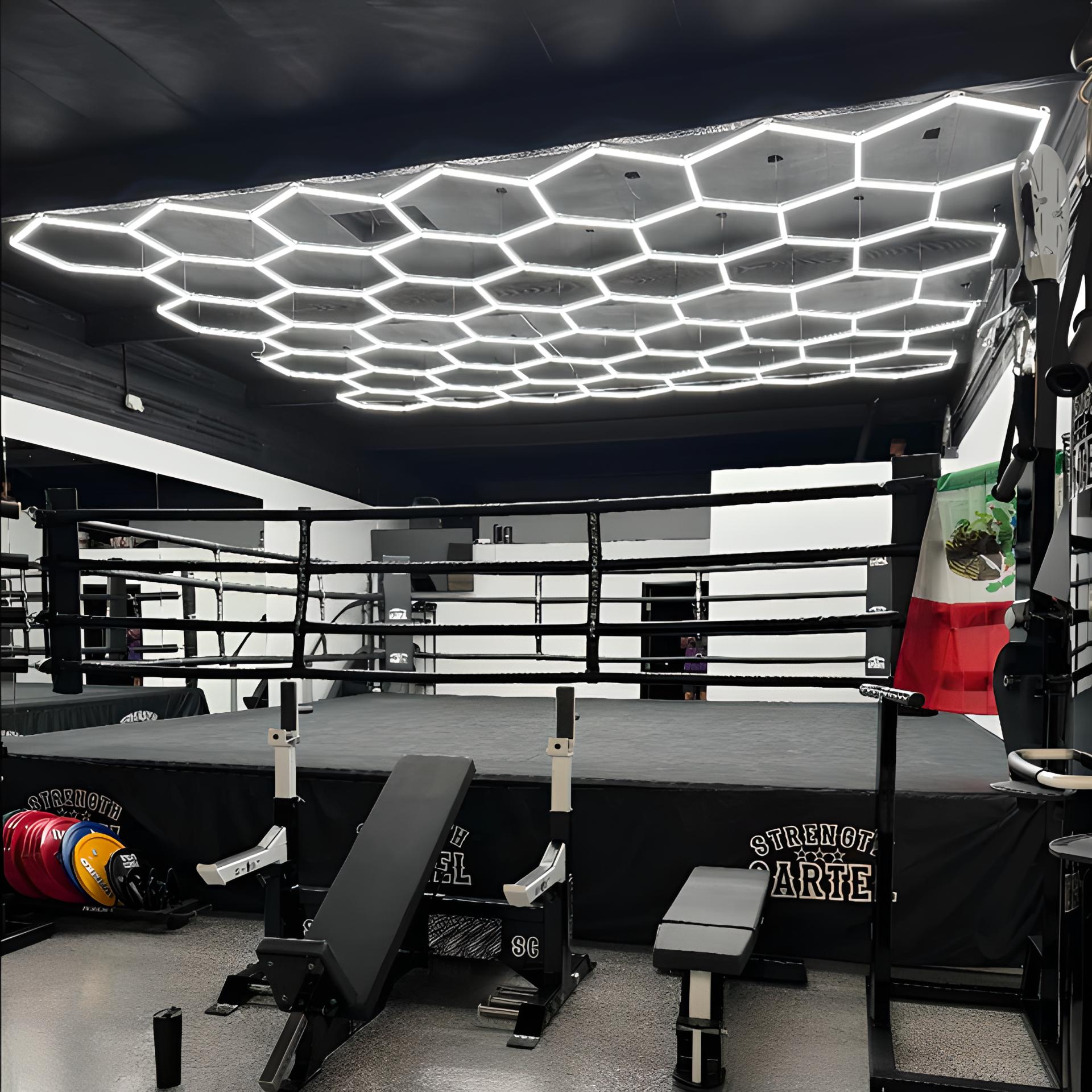 LED Hexagon Light brightens gym ceiling with modern, geometric LED panels for vibrant, customizable lighting effects.