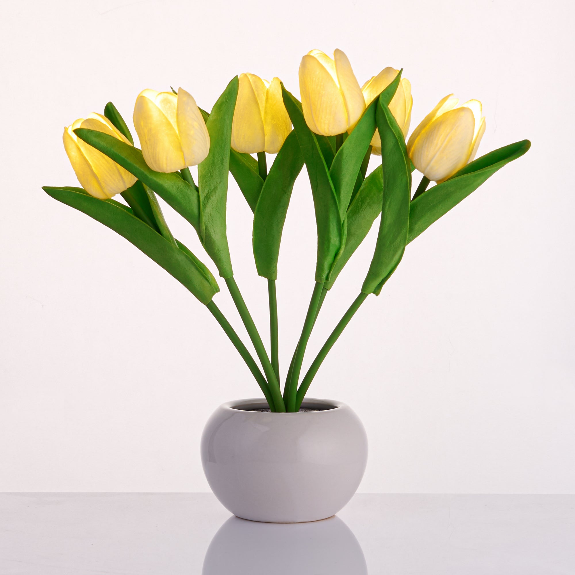LED Tulip Bouquet Light with realistic yellow tulips in a ceramic base emitting warm, cozy lamp glow for elegant decor.