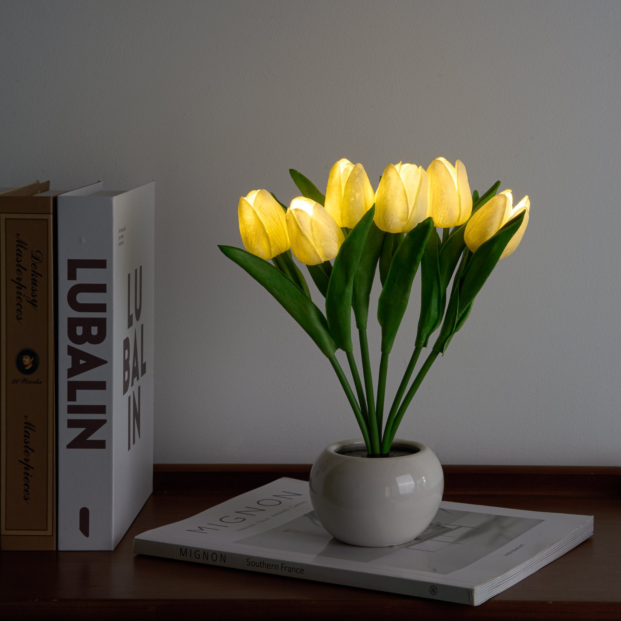 LED Tulip Bouquet Light glowing warmly in ceramic vase, perfect for elegant, battery-powered bedroom decor.