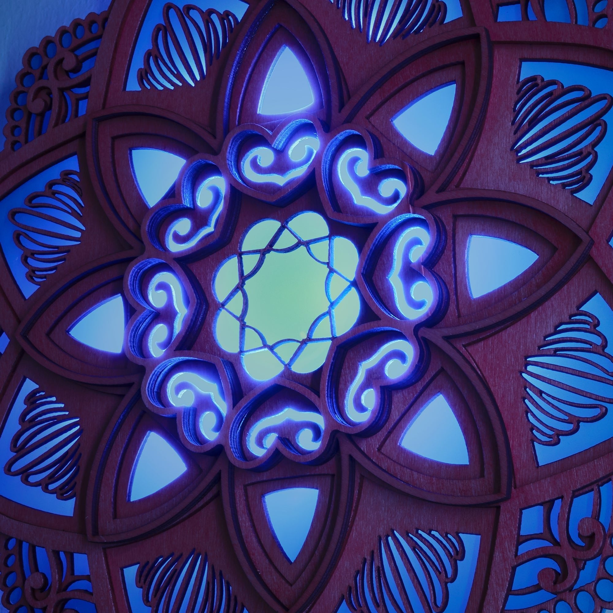 Lotus Mandala Yoga Wall Lamp glowing with calming blue light, enhancing peaceful yoga and meditation spaces.