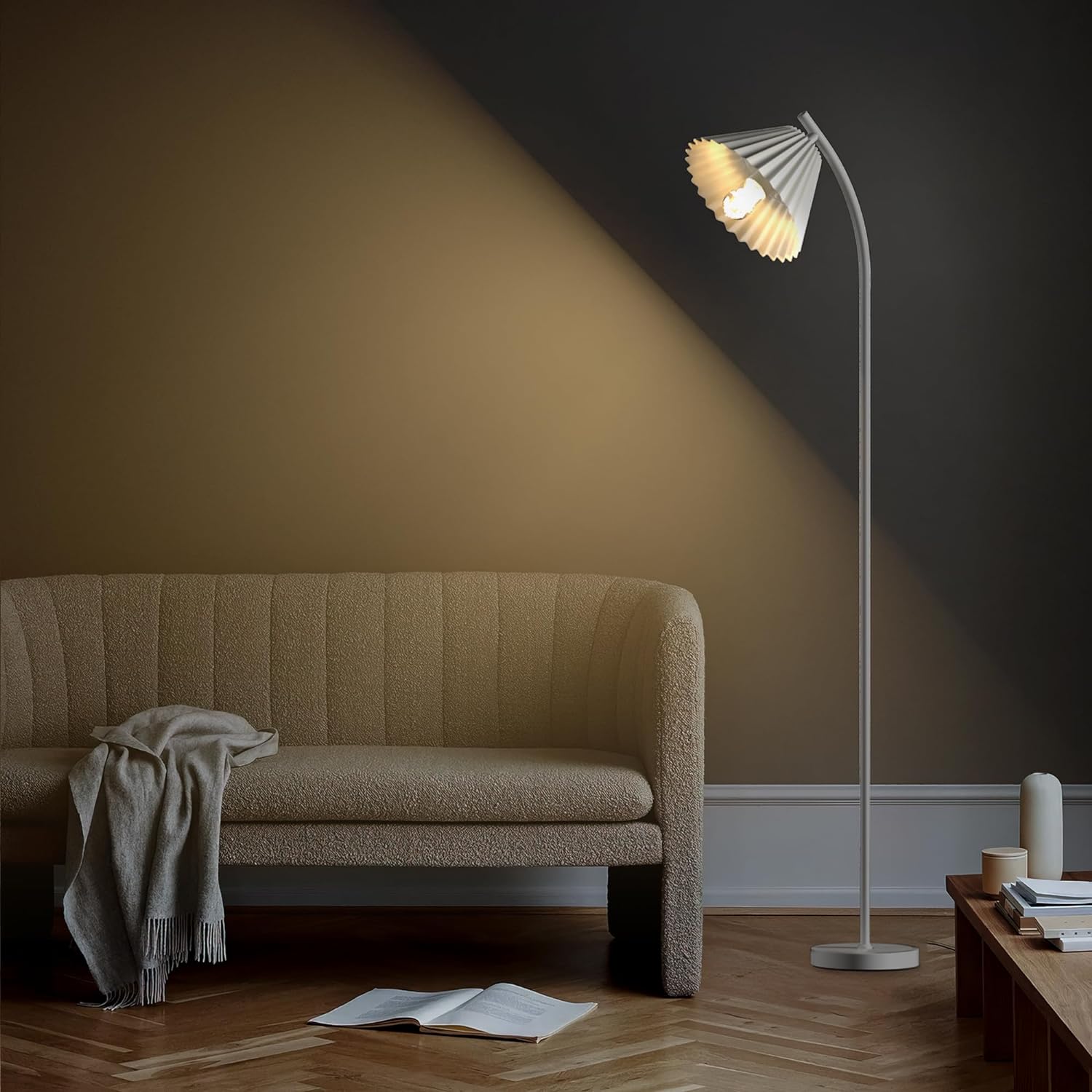 Minimalist Floor Lamp with Pleated Lampshade illuminating a cozy modern living room with sleek, elegant design.