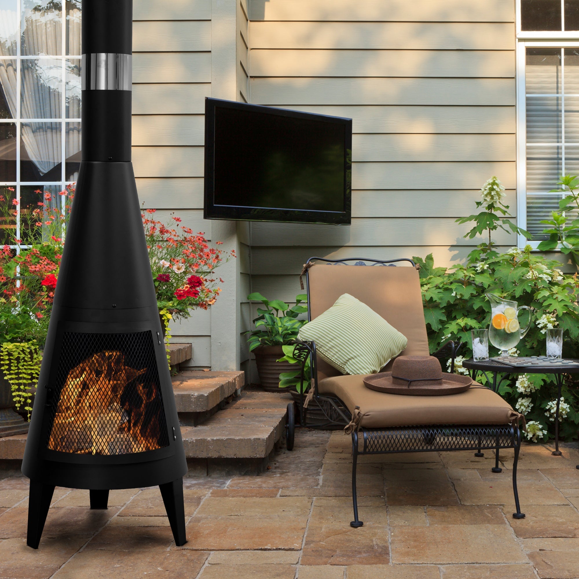 Modern Mesh Chiminea Fireplace warming a cozy outdoor patio with stylish design and crackling wood fire.