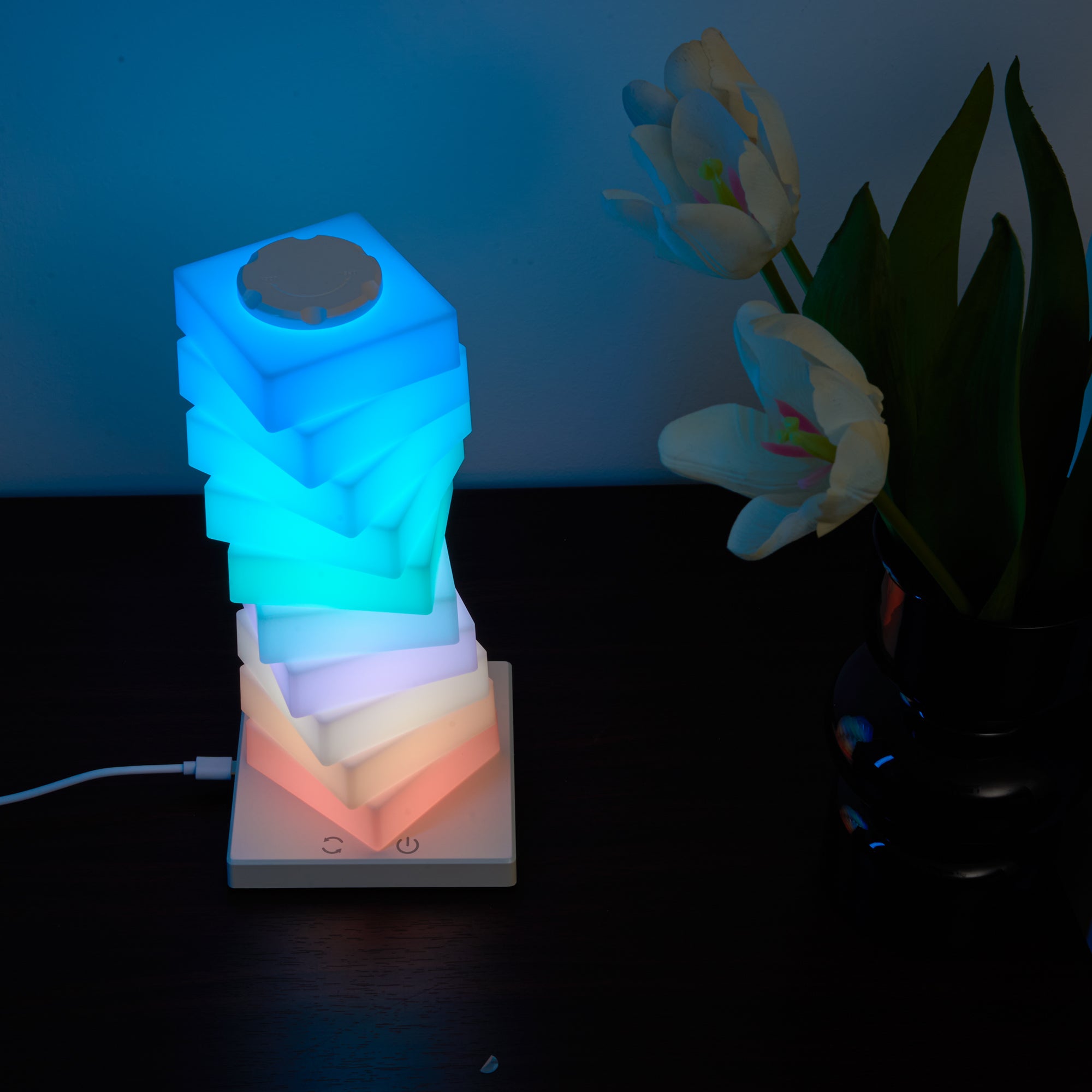 Modular Rotating Touch RGB Lamp glowing in blue and warm white with customizable stacked cubes on a desk.