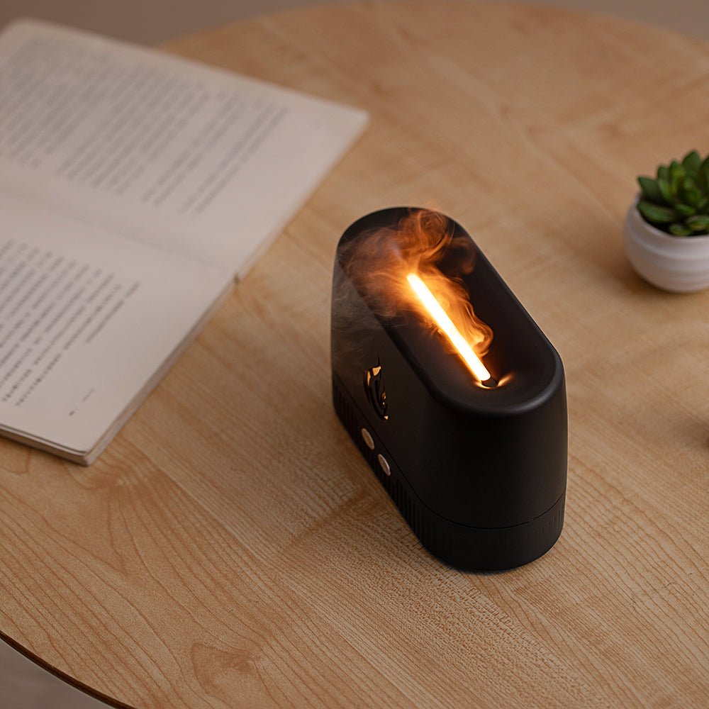 Portable Flame Diffuser & Humidifier emitting warm LED flame and mist on wooden table for cozy ambiance.