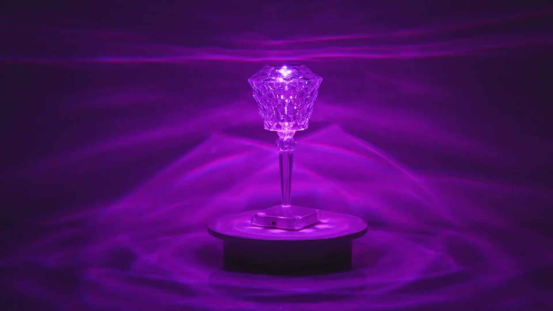 Load video: Rose-shaped crystal table lamp with multicolor LED lighting, used as romantic ambient decor for bedrooms or gift displays