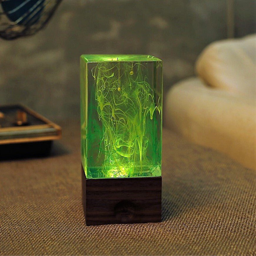 Resin Cube Table Decor - Aurora glowing green with handcrafted resin design and warm white ambient light.