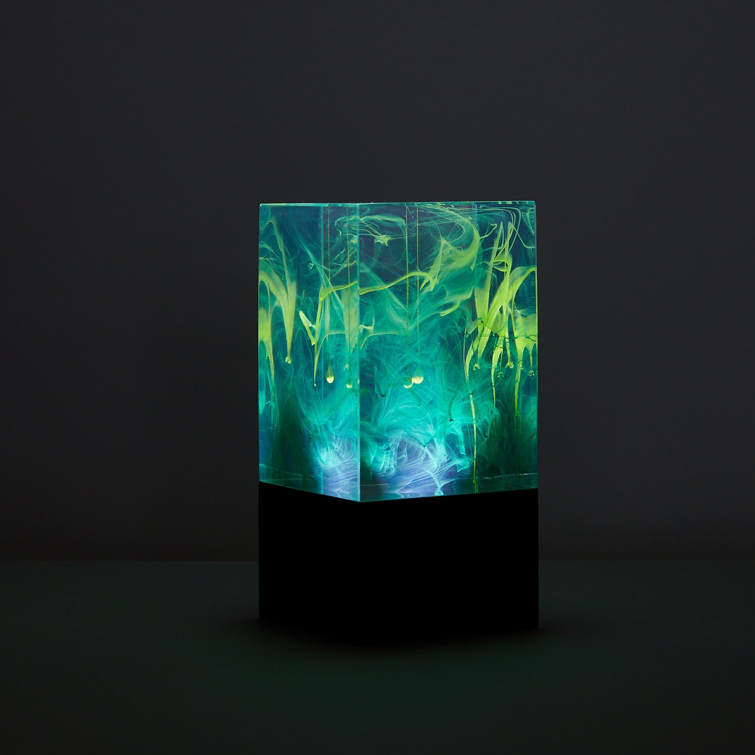 Resin Cube Table Decor - Aurora glowing with vibrant green and blue resin swirls, ambient cordless night light for mood settings.