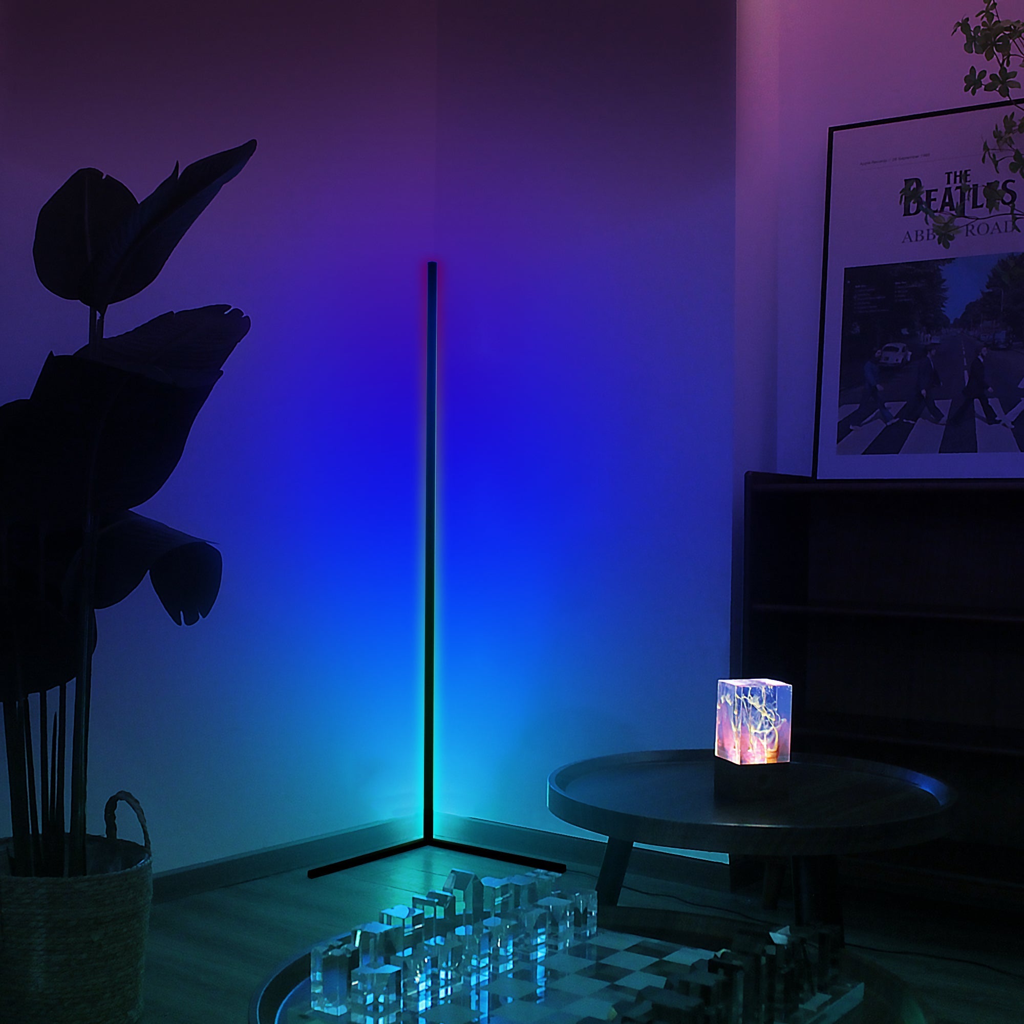 RGBCW Corner Floor Lamp glowing vibrant blue light in a minimalist corner setup for mood lighting.