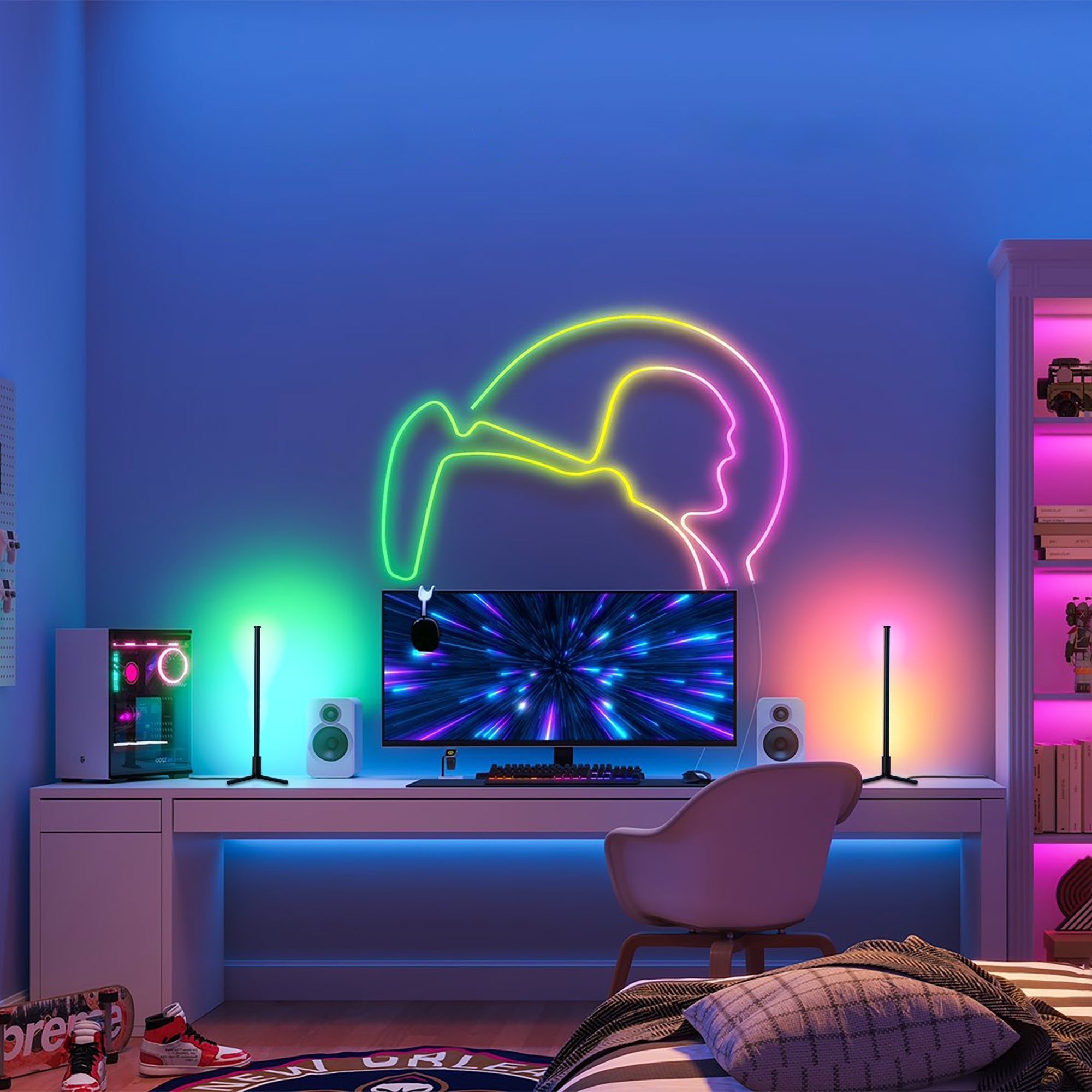 RGBCW Corner Table Lamp - Black illuminating a modern gaming desk setup with vibrant customizable RGB lighting.